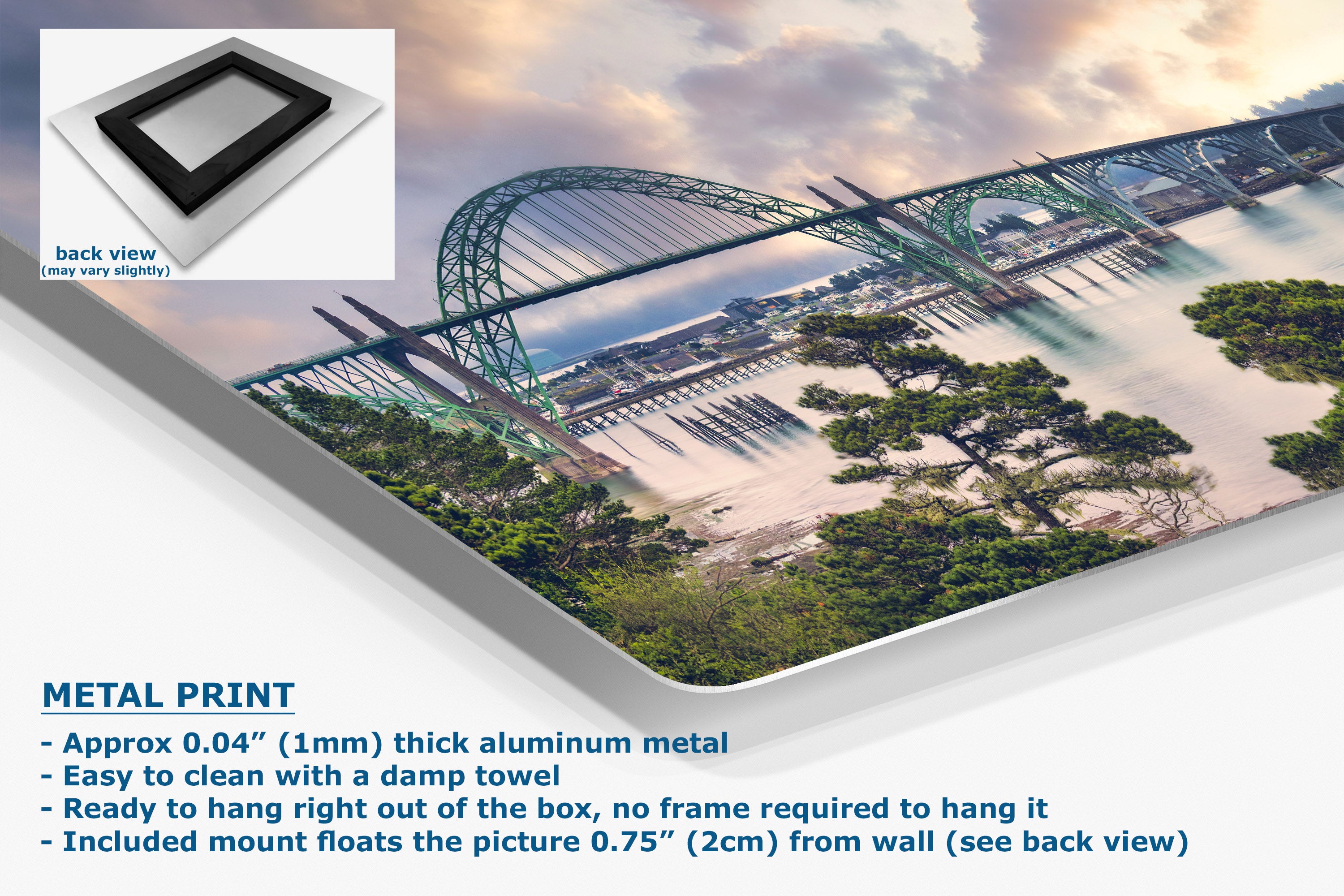 A large wall art print showing a scenic bridge over water with trees and a cloudy sky, presented at an angle with a small inset showing the back view of the frame mount. Text on the image reads 'METAL PRINT' and lists product details.