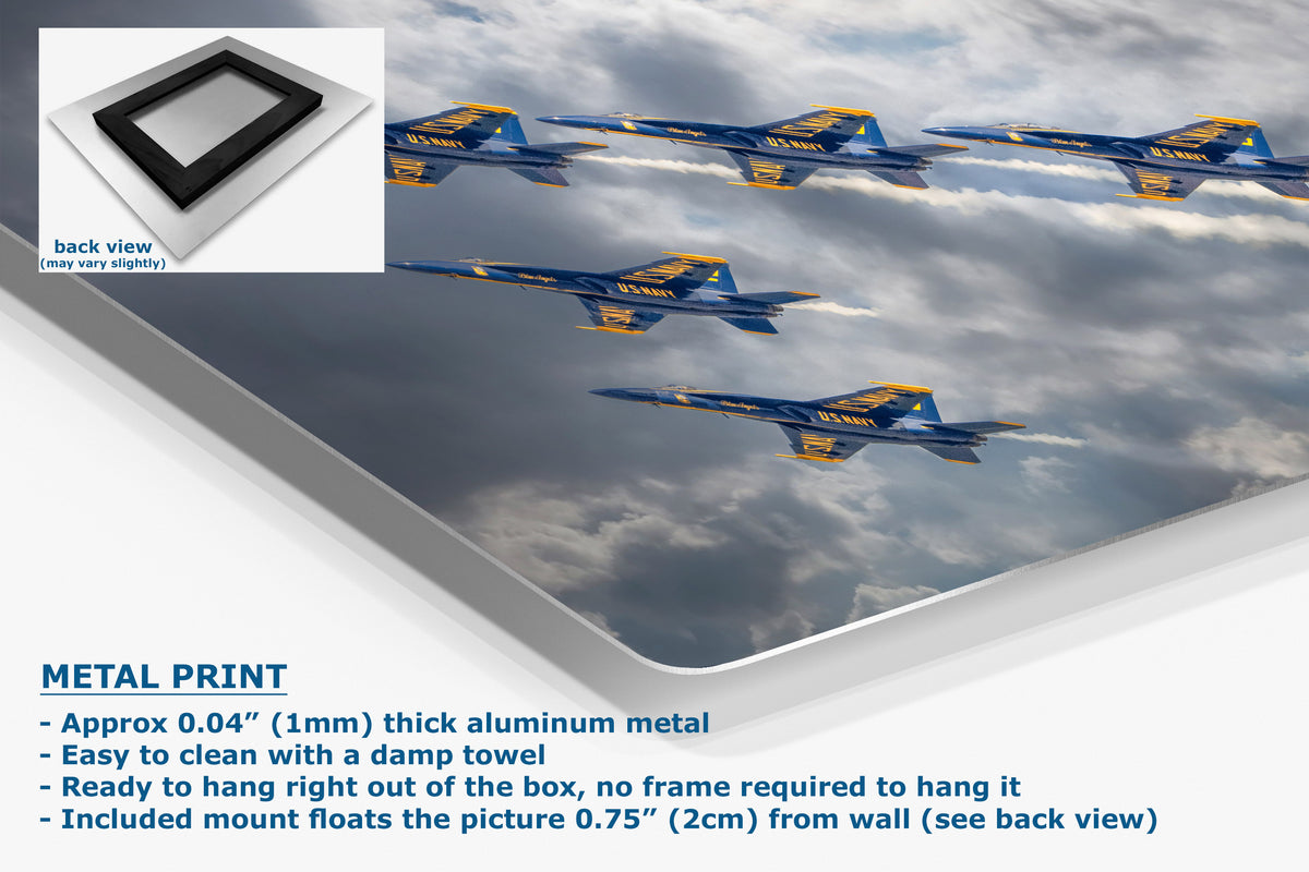 A corner view of an aluminum metal print panel displaying a photo of six blue and yellow jets flying through clouds, with a small inset showing the back view of the frame. Text on the left describes the product features: 'METAL PRINT'.