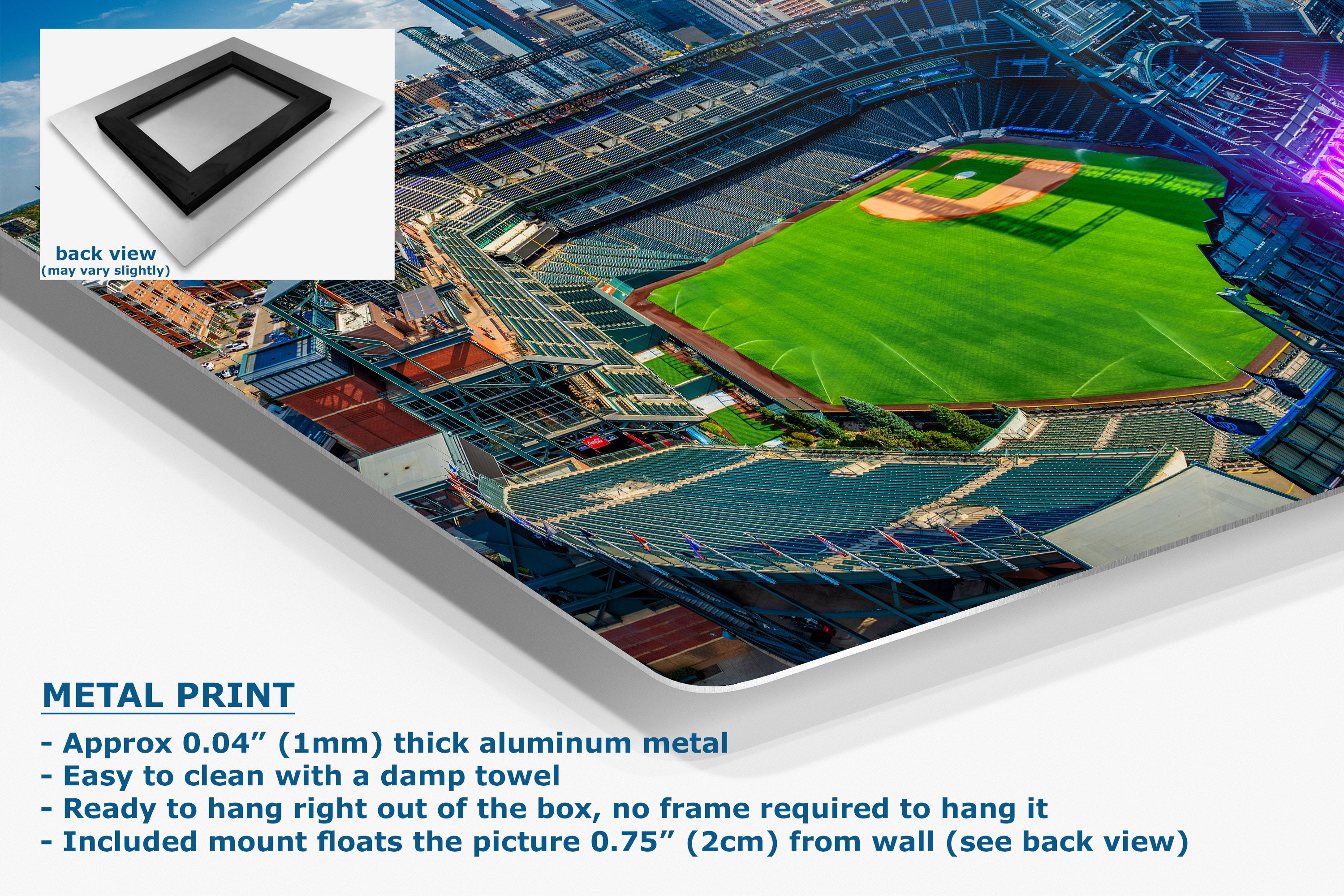 A corner view of an aluminum metal wall art print showing an aerial view of a baseball stadium with a green field, presented on a white background with product details and a small back-view inset.