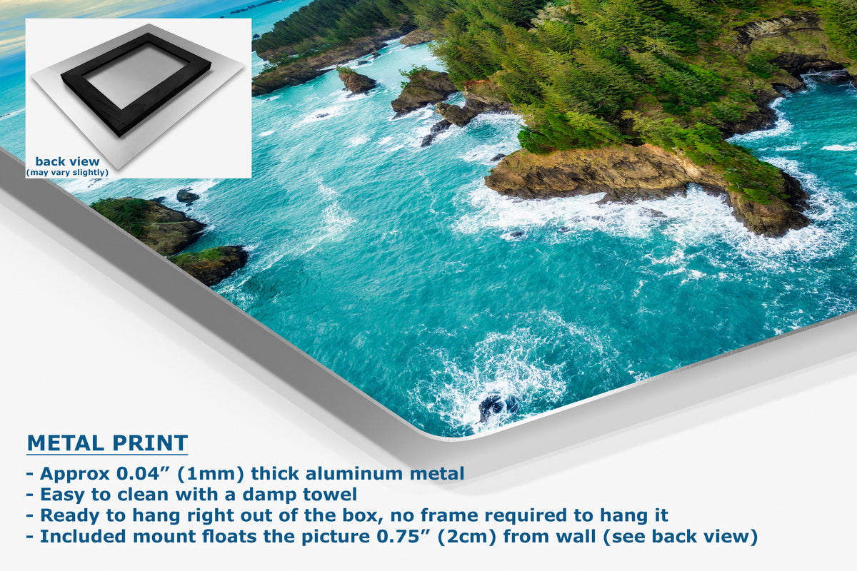 A corner view of a metal print panel displaying a vivid coastal scene with turquoise ocean water, rocky cliffs, and green vegetation. The image includes a small inset showing the back view of the panel, plus text describing the product.