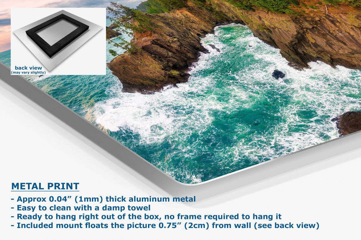 A large rectangular metal print showing a coastal ocean scene with turquoise water, white surf, and rocky cliffs, displayed at an angle on a white background. A small inset shows the back view of the print with a black frame.