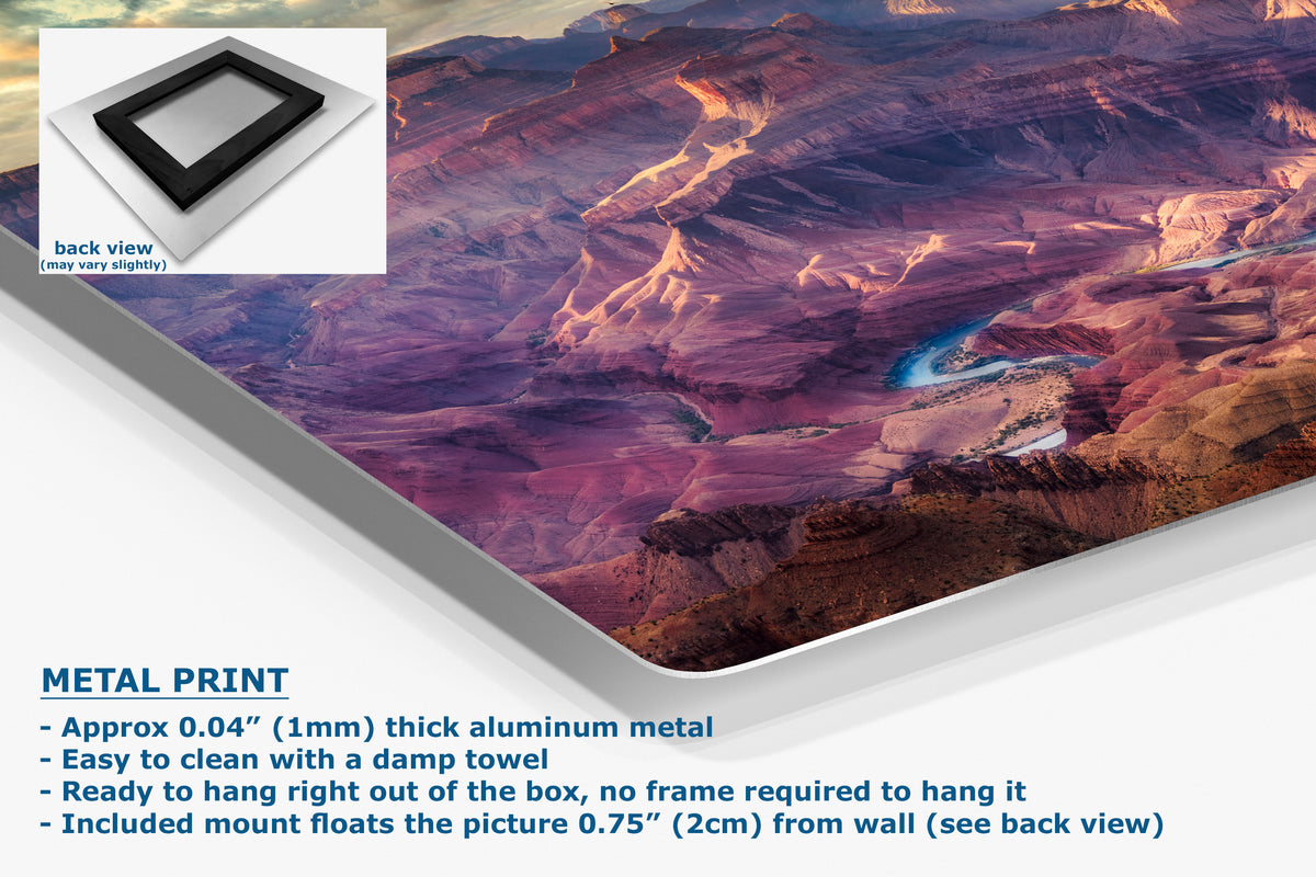 A corner view of an aluminum metal print panel featuring a colorful canyon landscape with purple, pink, and brown rock formations. The image includes a small inset showing the back view of the frame.