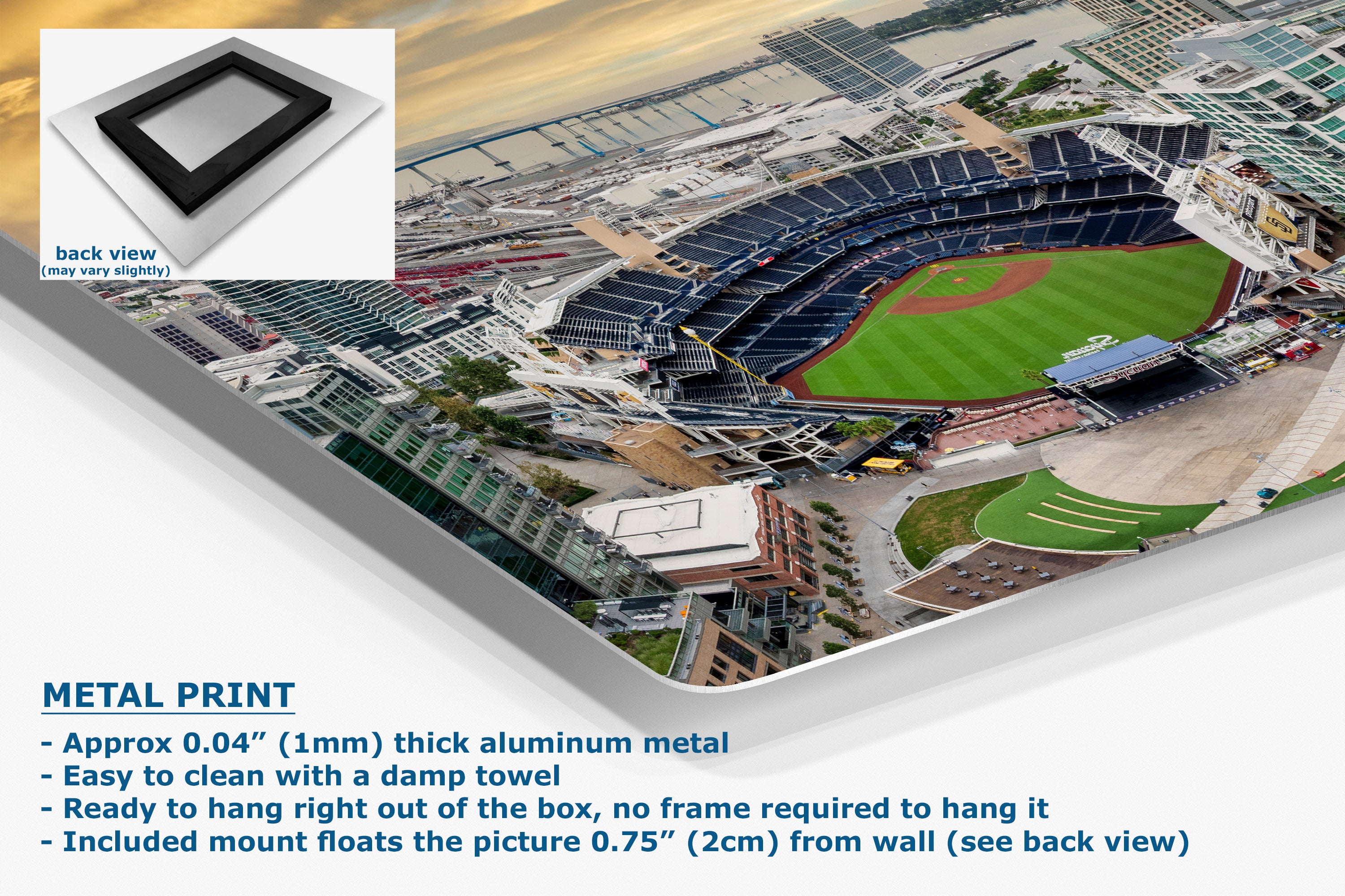 A large aluminum metal wall art print showing an aerial view of a baseball stadium, with a small inset showing the back view of the frame and text describing the product features.
