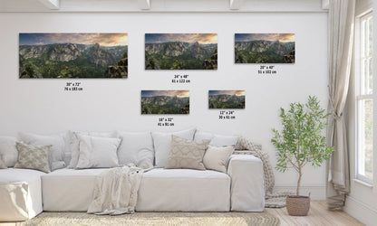 a living room with a white couch and four pictures on the wall