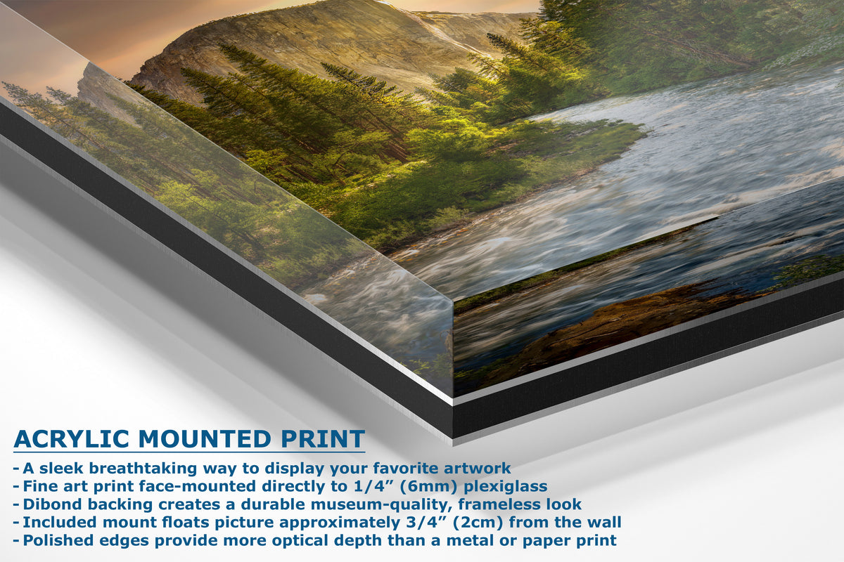 A corner view of an acrylic mounted art print of a mountain river landscape, shown at an angle with descriptive text detailing its frameless display and museum-quality backing.