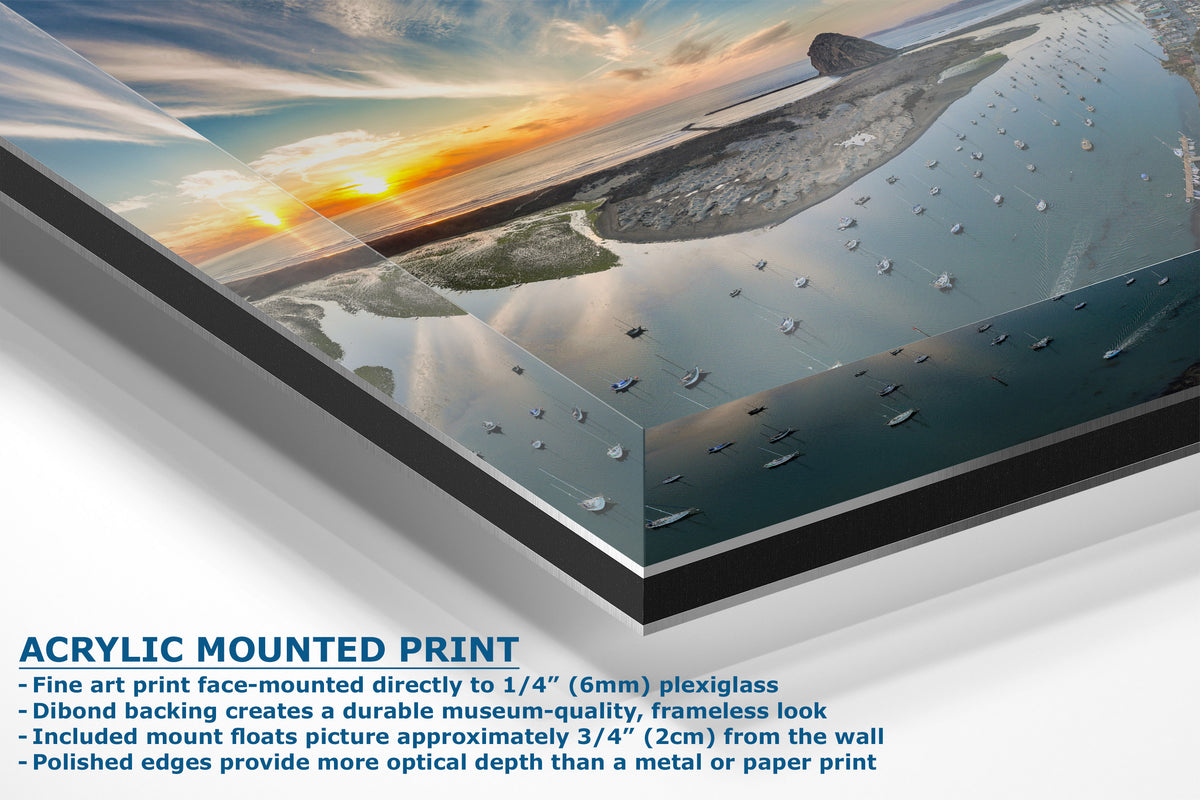 Acrylic mounted art print showing a coastal sunset scene with boats on the water, with product features and text overlay on a white background.