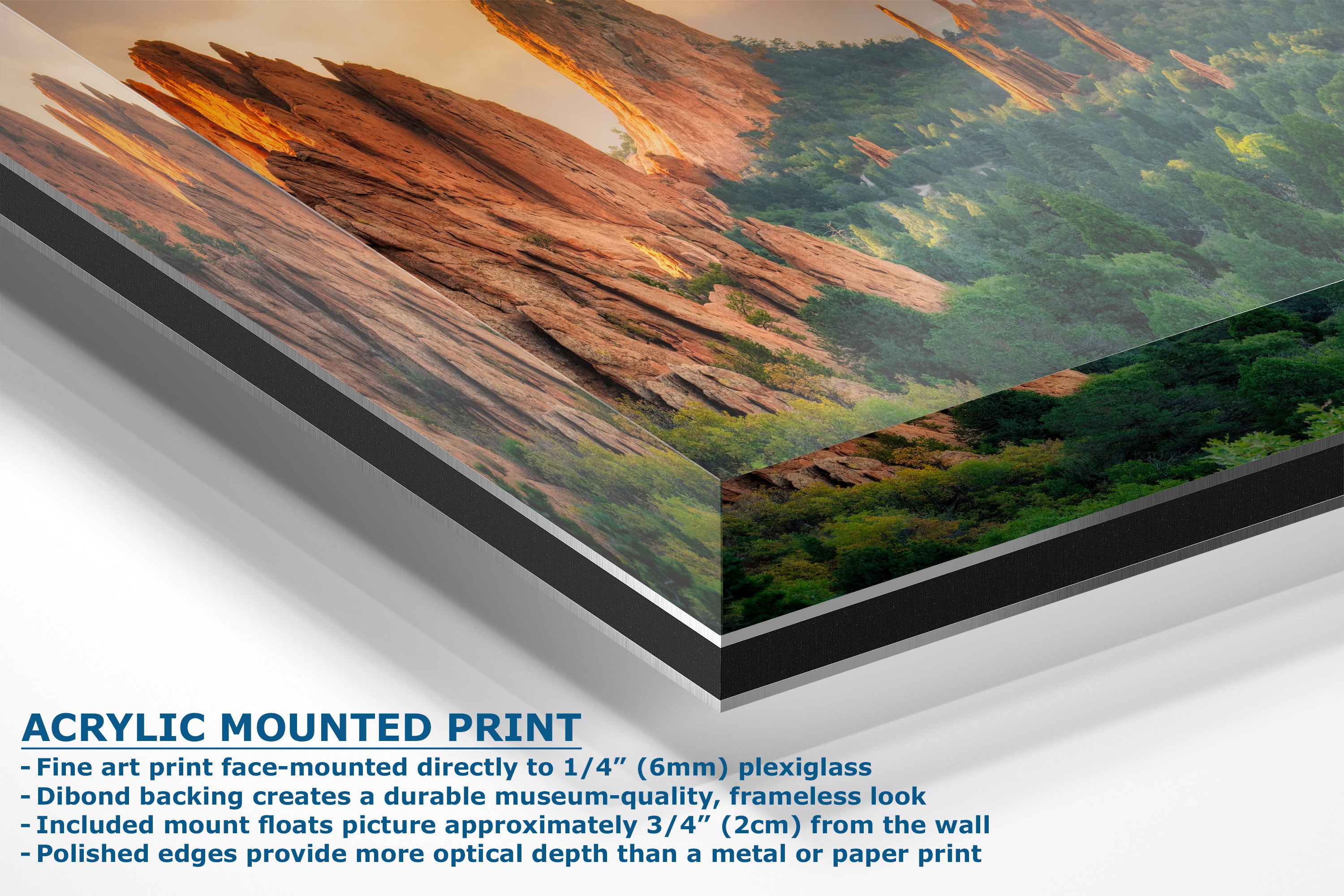 A corner view of an acrylic-mounted art print of a desert canyon landscape, showing a close-up of the printed panel with a black frame edge and descriptive text on a white background.