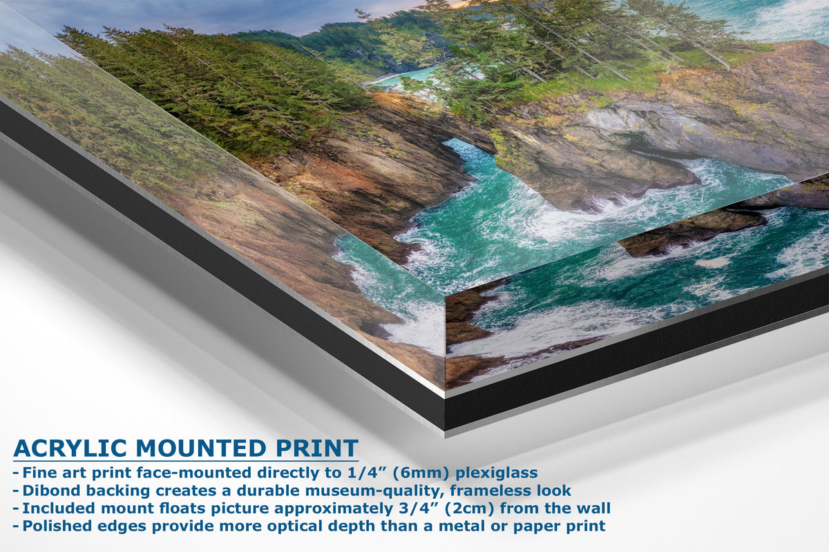 Acrylic mounted art print of a coastal landscape with turquoise water, rocky shorelines, and green forested hills, shown at an angle with product details and text on a white background.