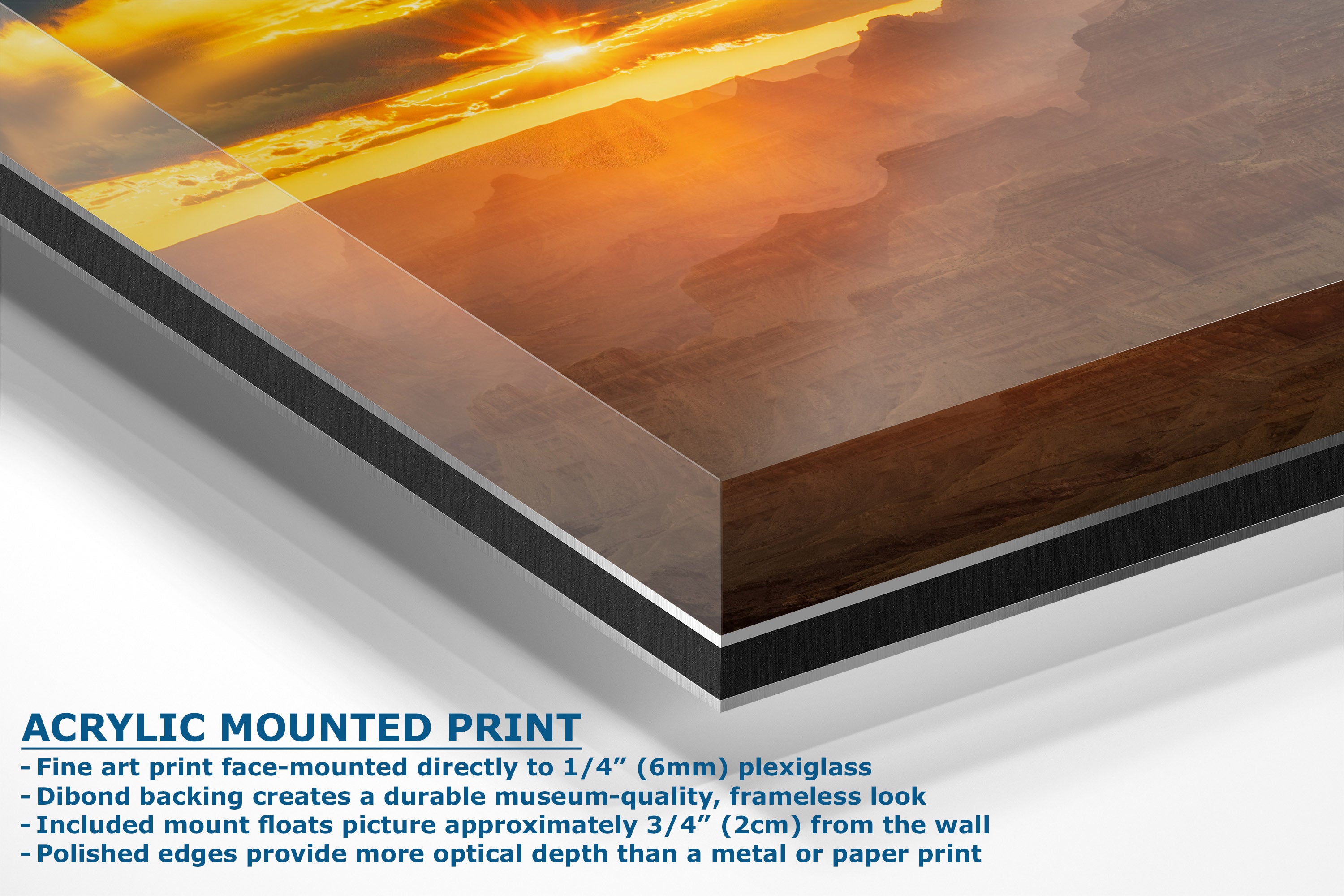 Acrylic mounted art print showing a warm sunset landscape with orange and brown tones, displayed at an angle with descriptive text on a white background.