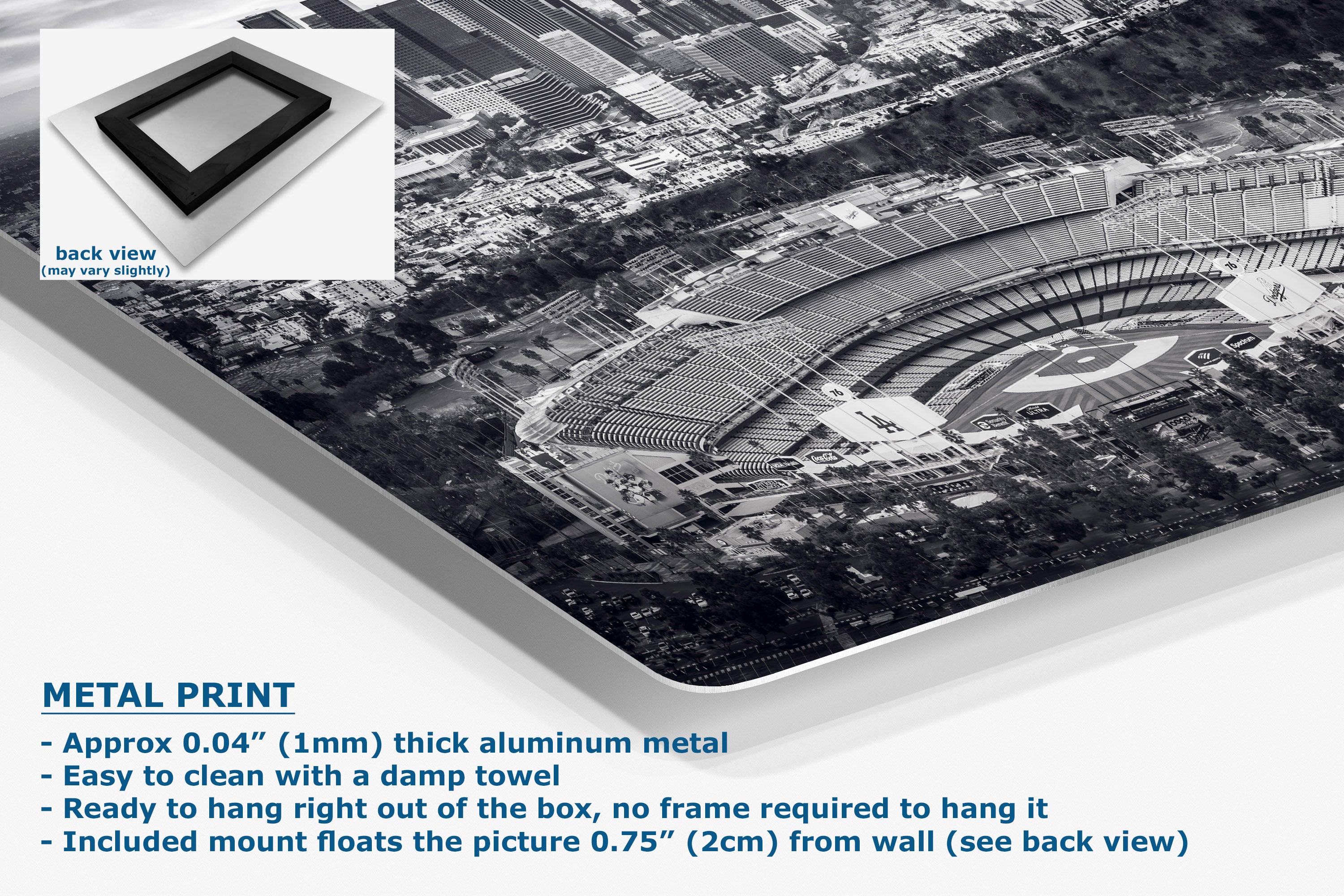 A large rectangular metal print showing a black-and-white aerial Dodger Stadium scene, displayed at an angle with a small inset back-view swatch and product text describing the aluminum finish and mounting details.
