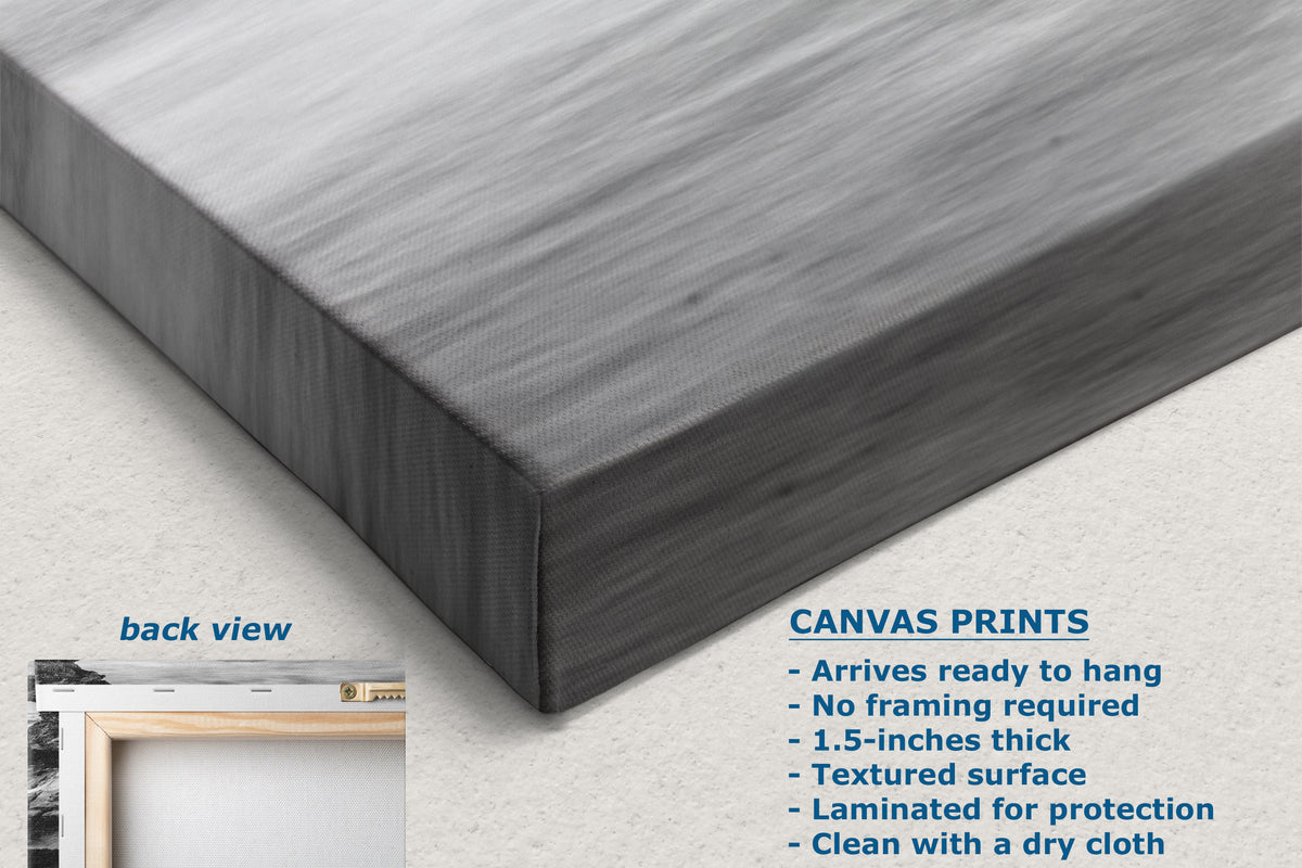 A dark gray canvas bed skirt shown from both front and back angles, with text detailing its features and care instructions on a light gray background.