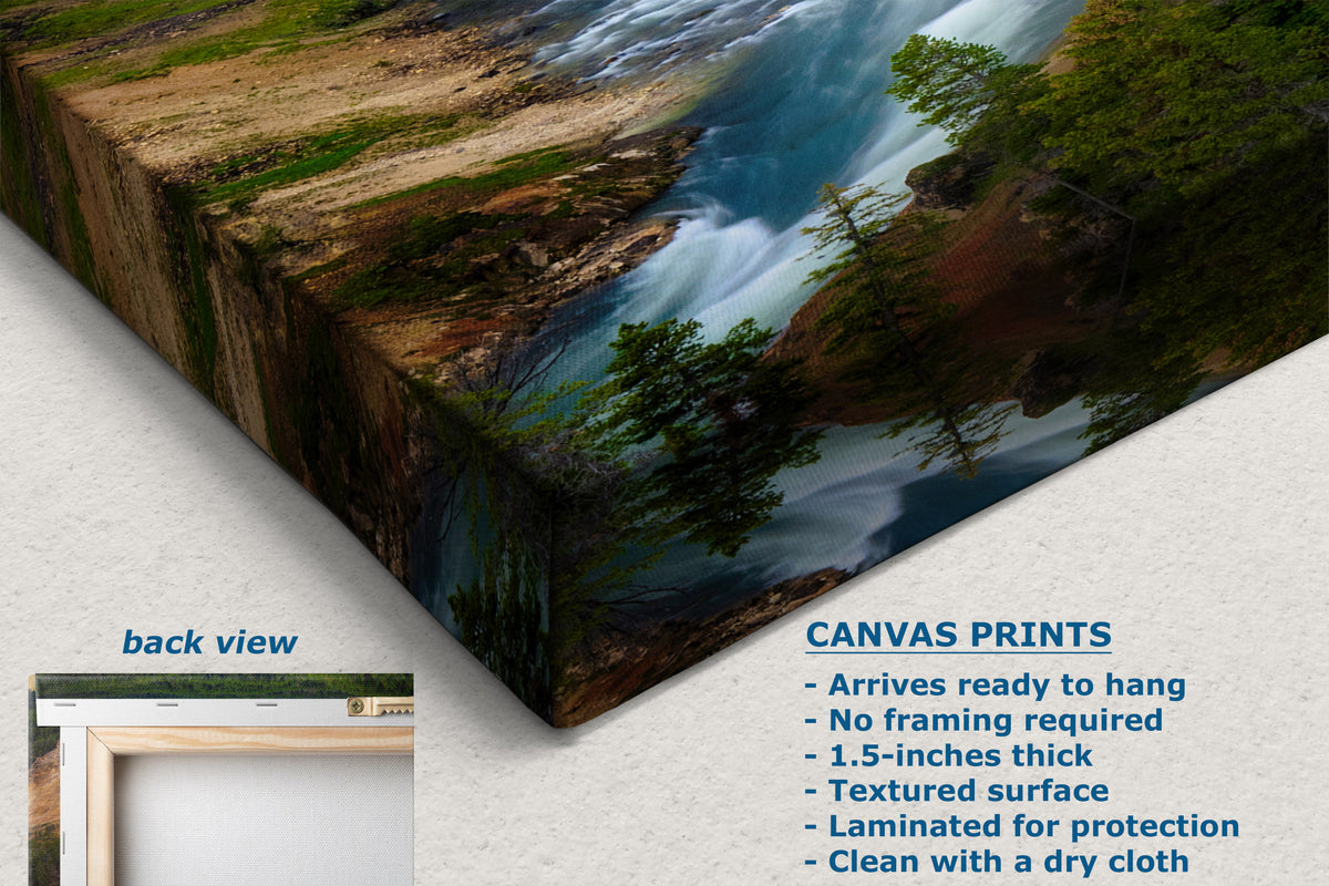 A canvas wall art print showing a forest river scene, displayed at an angle with a text overlay detailing product features and a small inset showing the back view.