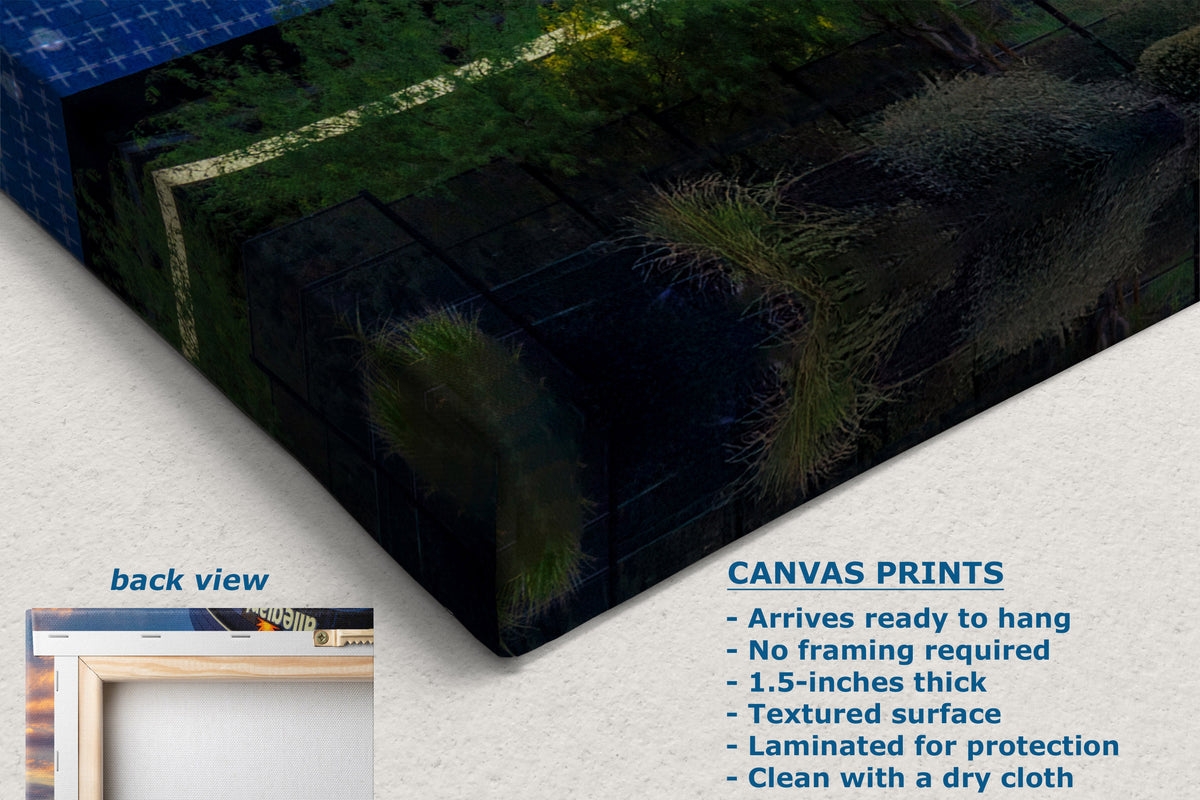 A corner veiw of a canvas wall art print shown at an angle on a light neutral background, with text describing product features and a small inset labeled back view. The artwork depicts a dark textured scene with green mossy areas and a blue tiled section.