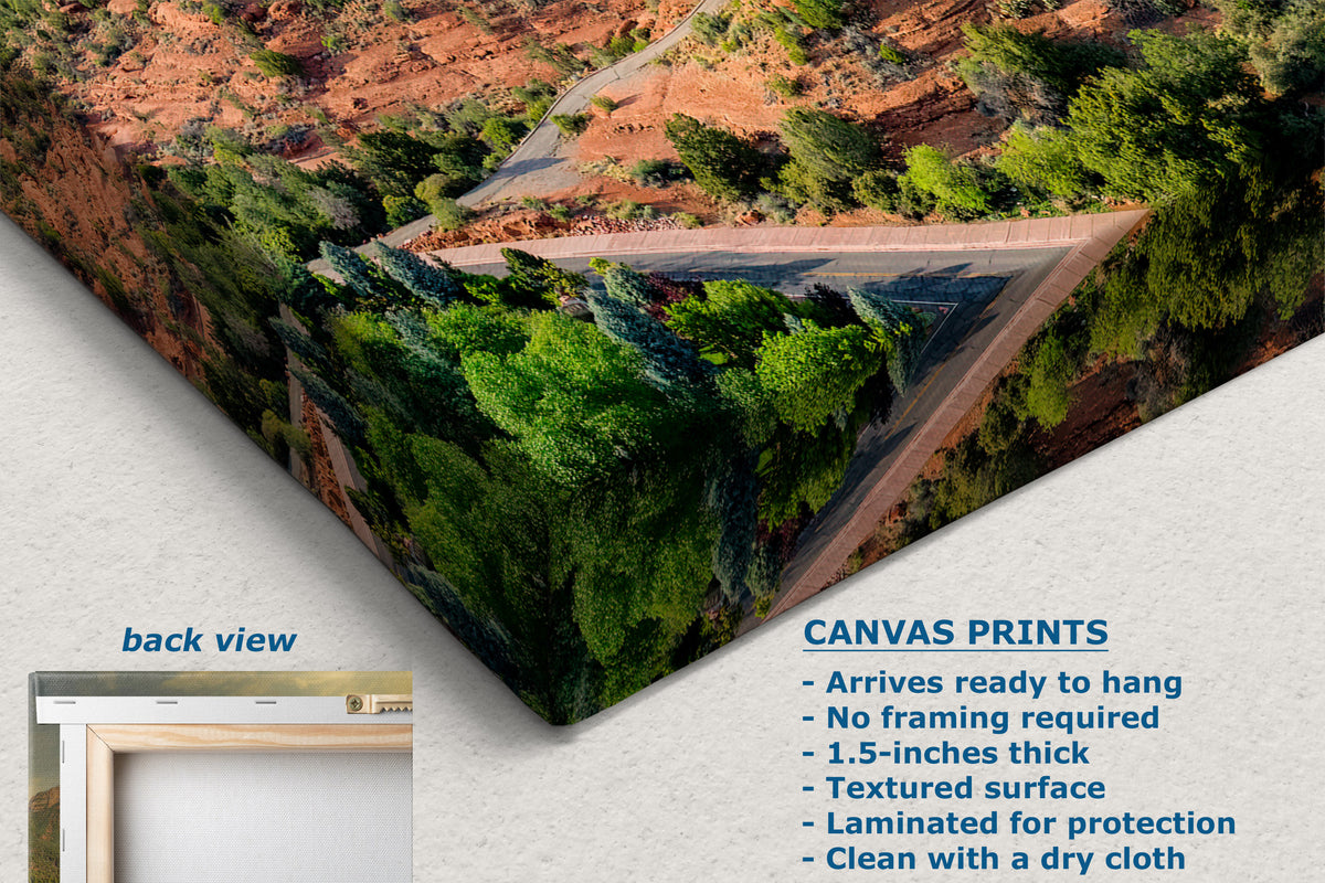 Canvas wall art print showing a canyon landscape with green trees and a winding road, displayed at an angle with a small inset labeled back view and product text describing canvas print features.