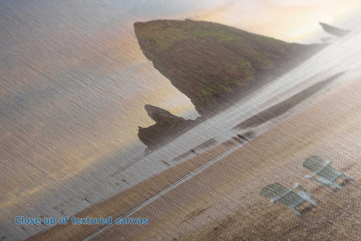 Close-up of a textured canvas print showing the detail of what a canvas looks like in person, depicting a coastal landscape and two beach chairs, with blue text reading 'Close up of textured canvas' in the lower left.