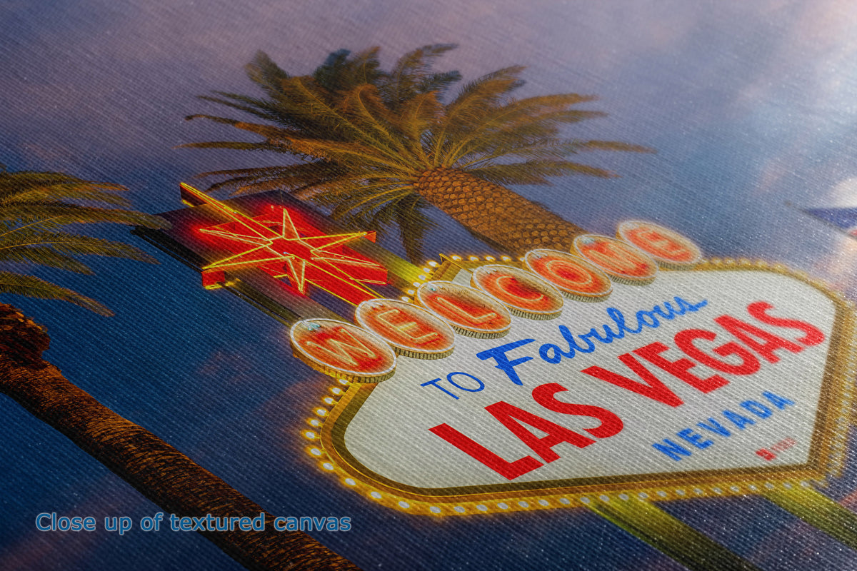Close-up of the detail and texture of a canvas print depicting the iconic 'Welcome to Fabulous Las Vegas' sign with palm trees and a blue sky background.