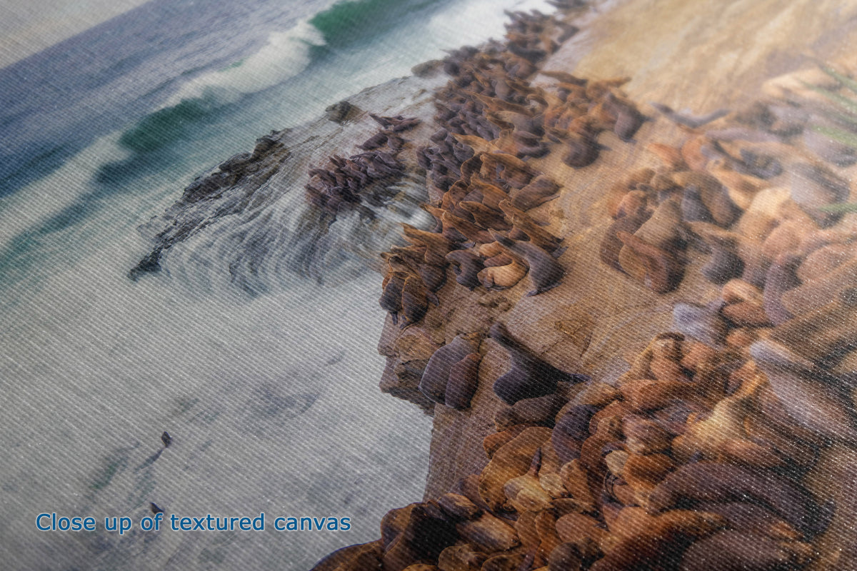 Close-up of a textured canvas print depicting a rocky coastline with waves, showing the fabric texture and printed details.