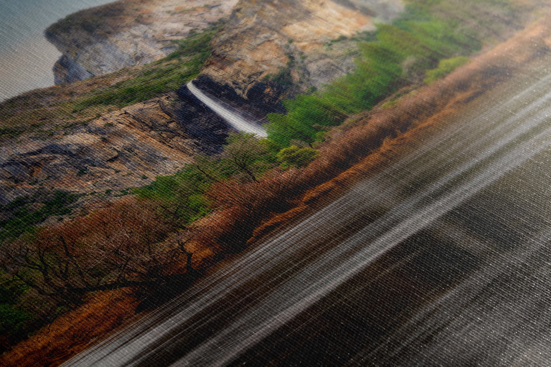 Close-up of canvas print texture showing fine art nature photography of Yosemite's granite cliffs and Bridalveil Fall