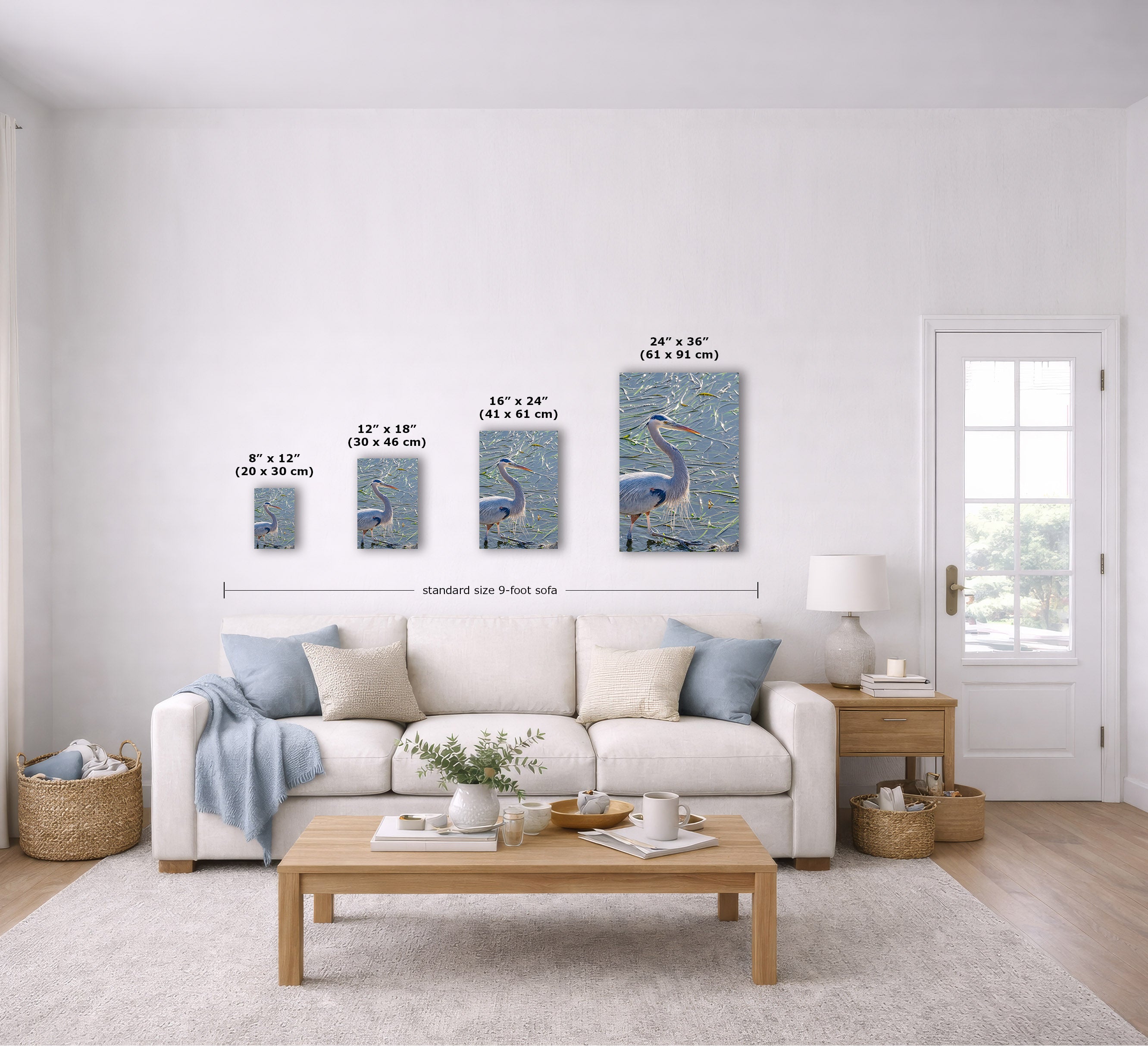 A staged living room shows a set of four vertical wall art prints with peacock imagery, displayed above a white sofa. The prints are shown in four sizes with dimension labels overlaid.