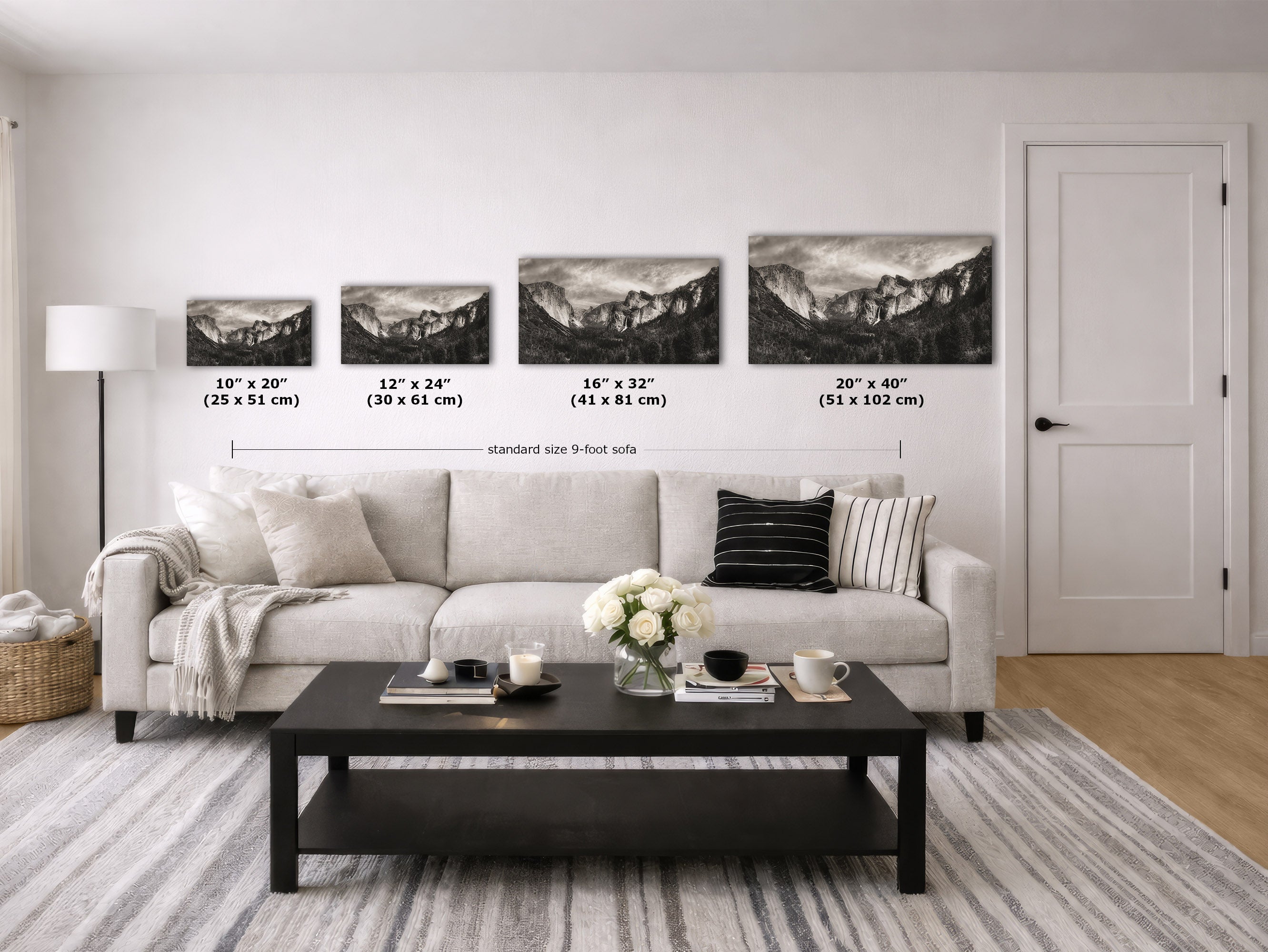A staged living room shows a light sofa, black coffee table, rug, lamp, and four framed black-and-white mountain landscape prints on the wall. Small size labels and a 9-foot scale line are overlaid near the artwork to communicate wall dimensions.