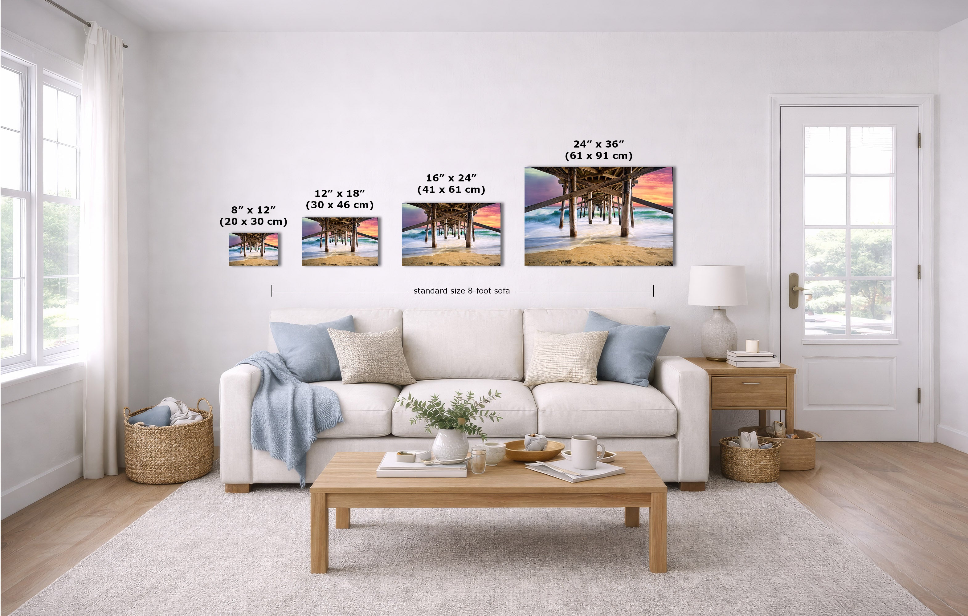 A staged living room shows four beach landscape prints mounted above a white sofa. The image includes size callouts for each print: 8 x 12 inches, 12 x 18 inches, 16 x 24 inches, and 24 x 36 inches, plus a note for a standard 8-foot side.