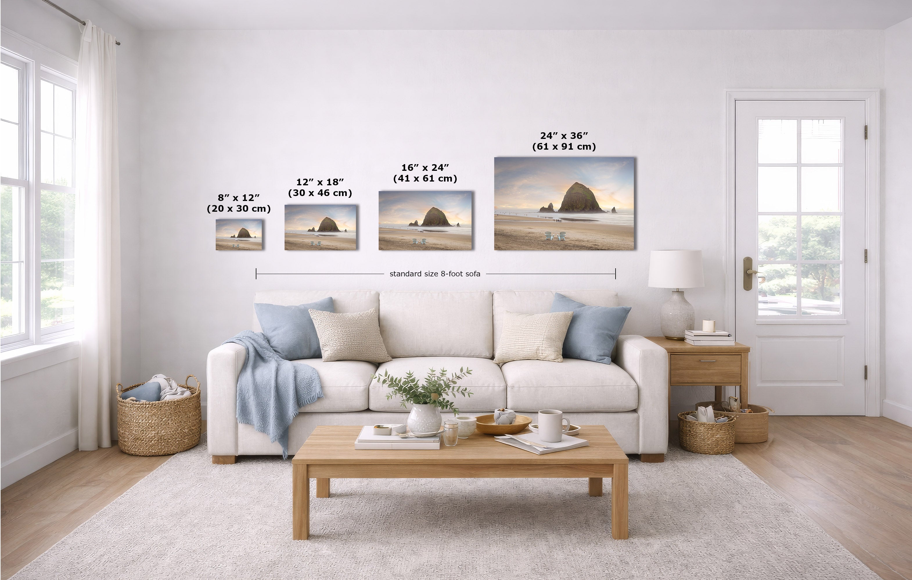 A staged living room with a white sofa, coffee table, and wall-mounted beach landscape prints. Black dimension labels and arrows show the width of each print and a standard 8-foot wall spacing.