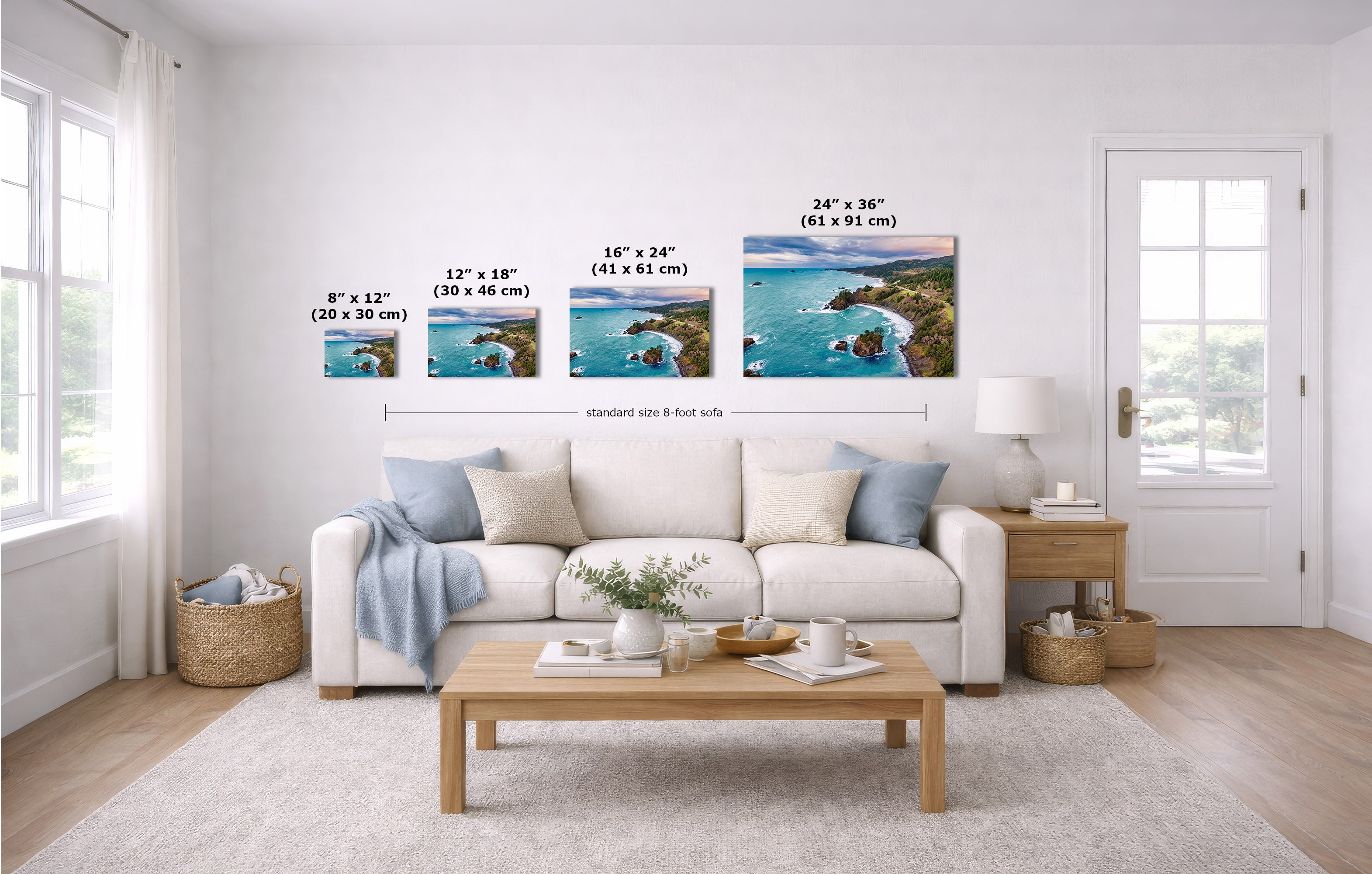 A staged living room shows a set of four coastal landscape wall art prints above a white sofa, with size labels overlaid for each print.