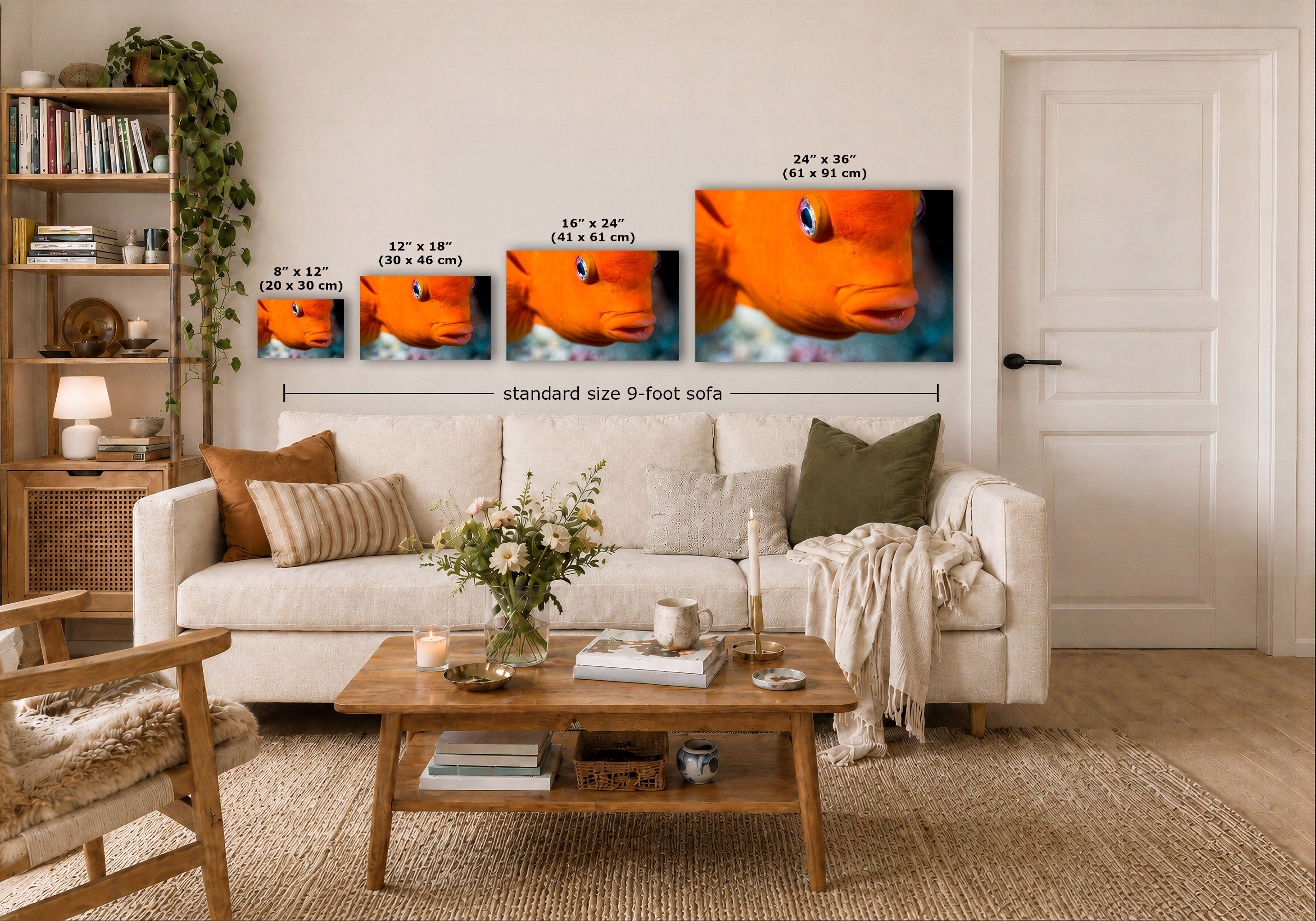A staged living room shows a set of four wall art prints above a white sofa, each with size text labels. The prints depict close-up orange fish with blue water.