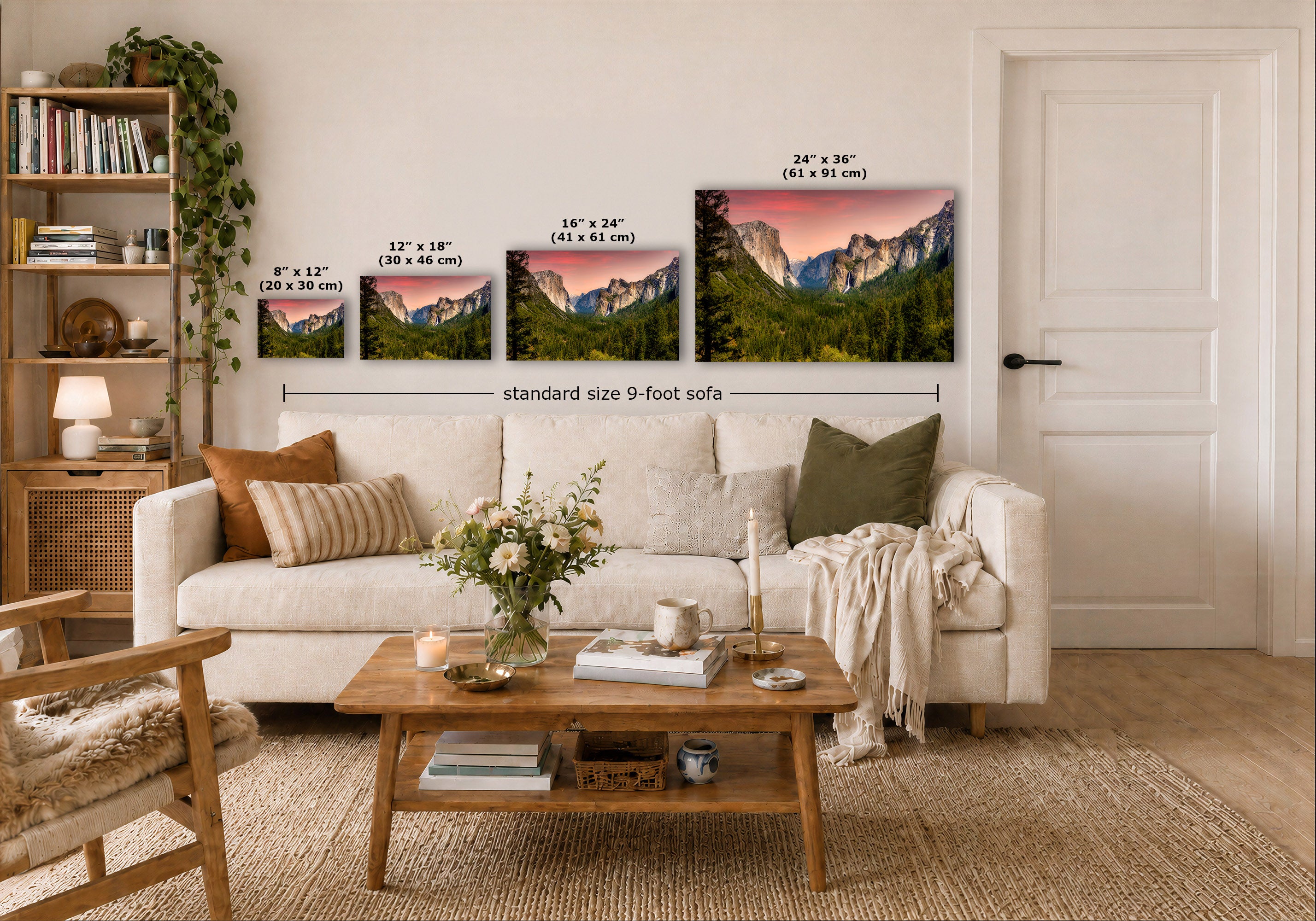 A staged living room shows a white sofa with pillows, a wooden coffee table, shelving, and a door, with four mountain landscape prints mounted above the sofa. White dimension lines and text indicate the sizes of the prints and note 'standard size 9-foot sofa'.