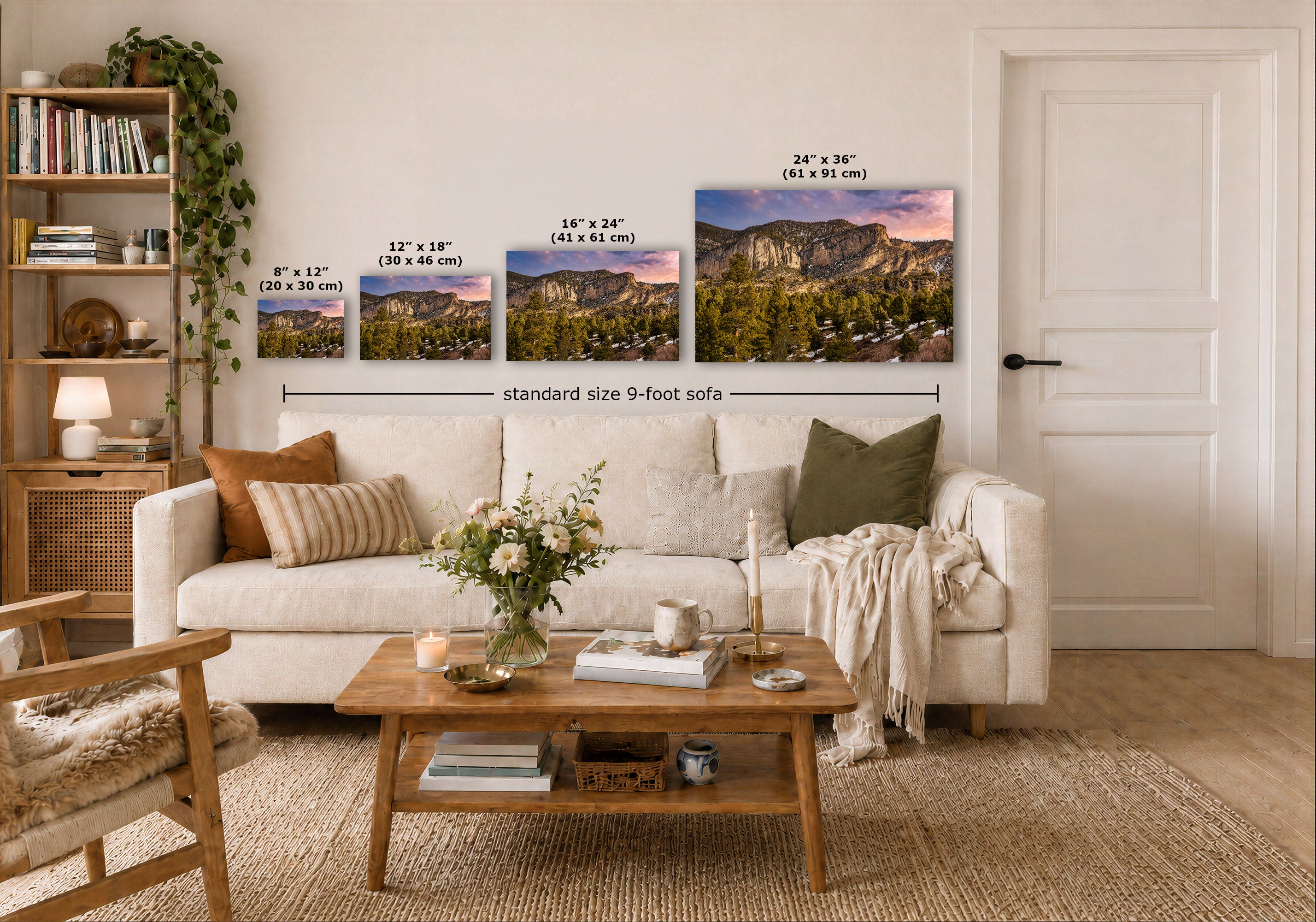 A staged living room shows a white sofa with pillows, a wooden coffee table, shelving, and a door, with three landscape wall art prints above the sofa and overlaid size labels for the prints. 