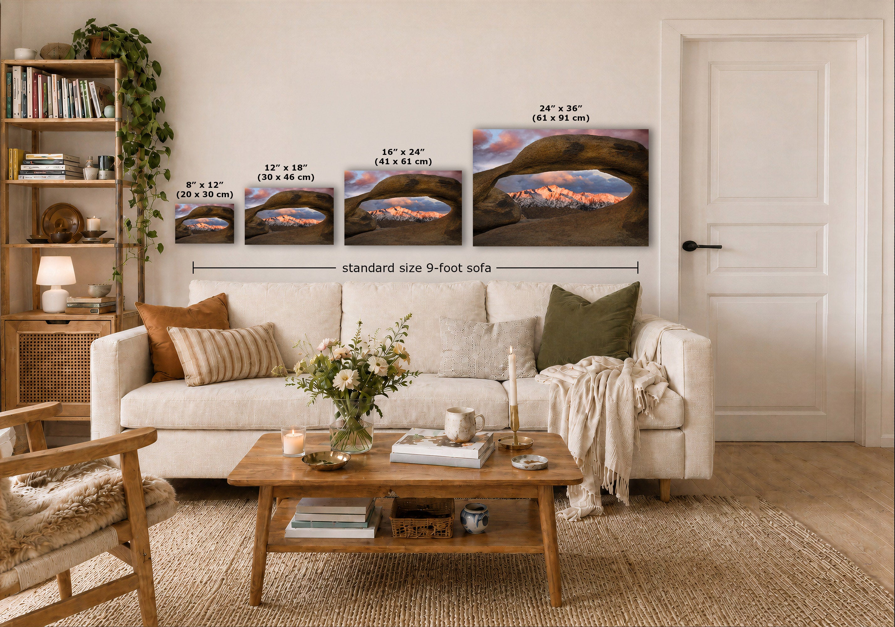 A styled living room showing a set of four landscape art prints mounted on a white wall above a sofa. The prints depict a glowing sunset over a dark rocky canyon, with size labels overlaid on each print and a dimension line reading 'standard size 9-foot sofa'.
