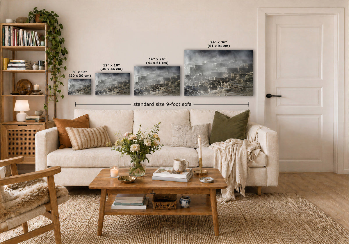 A staged living room shows a white sofa with decorative pillows and a wooden coffee table in front. Above the sofa, four wall art prints are displayed with overlaid size labels and a dimension line reading 'standard size 9-foot sofa.