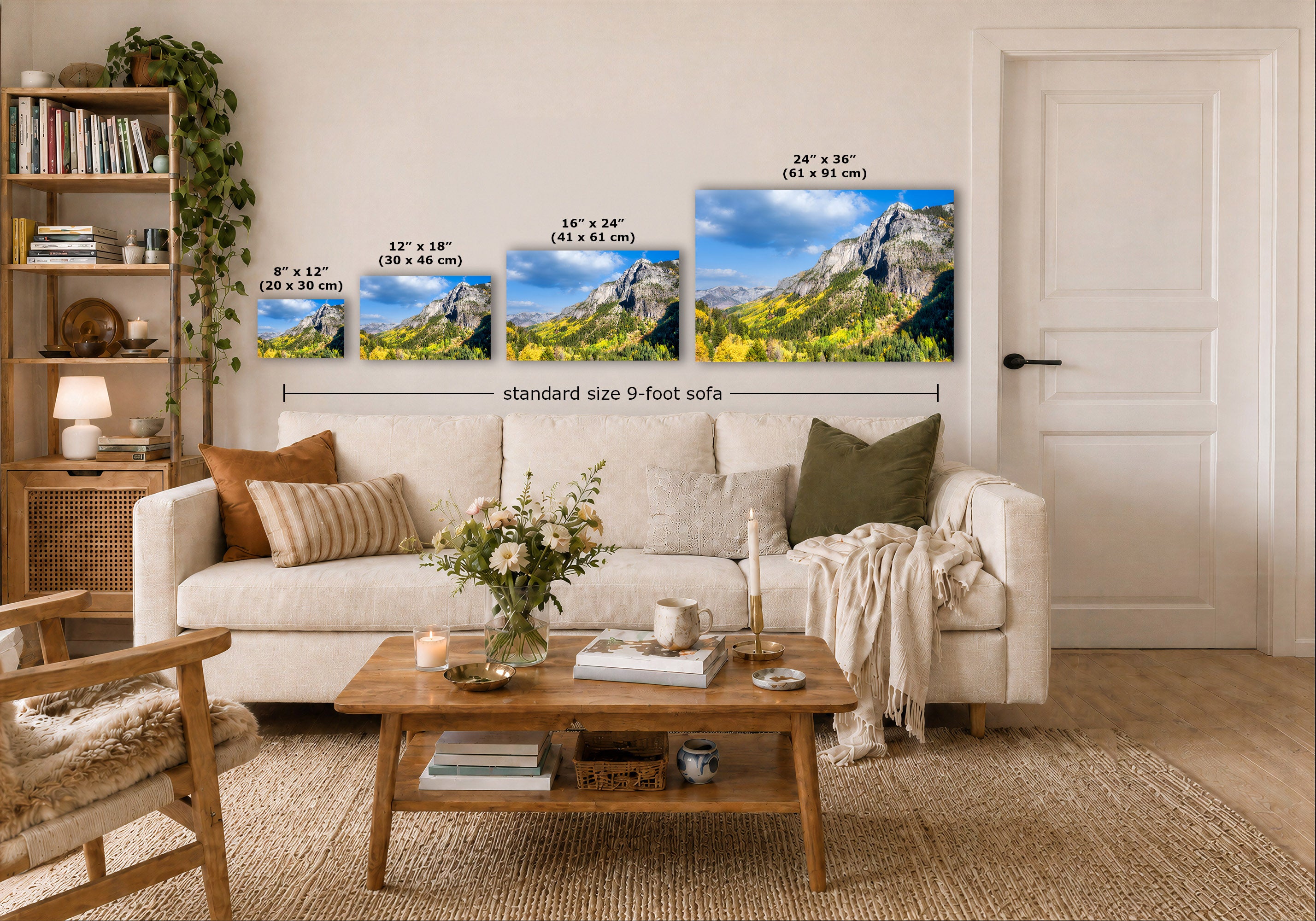 A staged living room shows a set of four landscape wall art prints mounted above a sofa. The prints depict mountain scenery with blue sky and green/yellow vegetation, with size labels overlaid in black text.