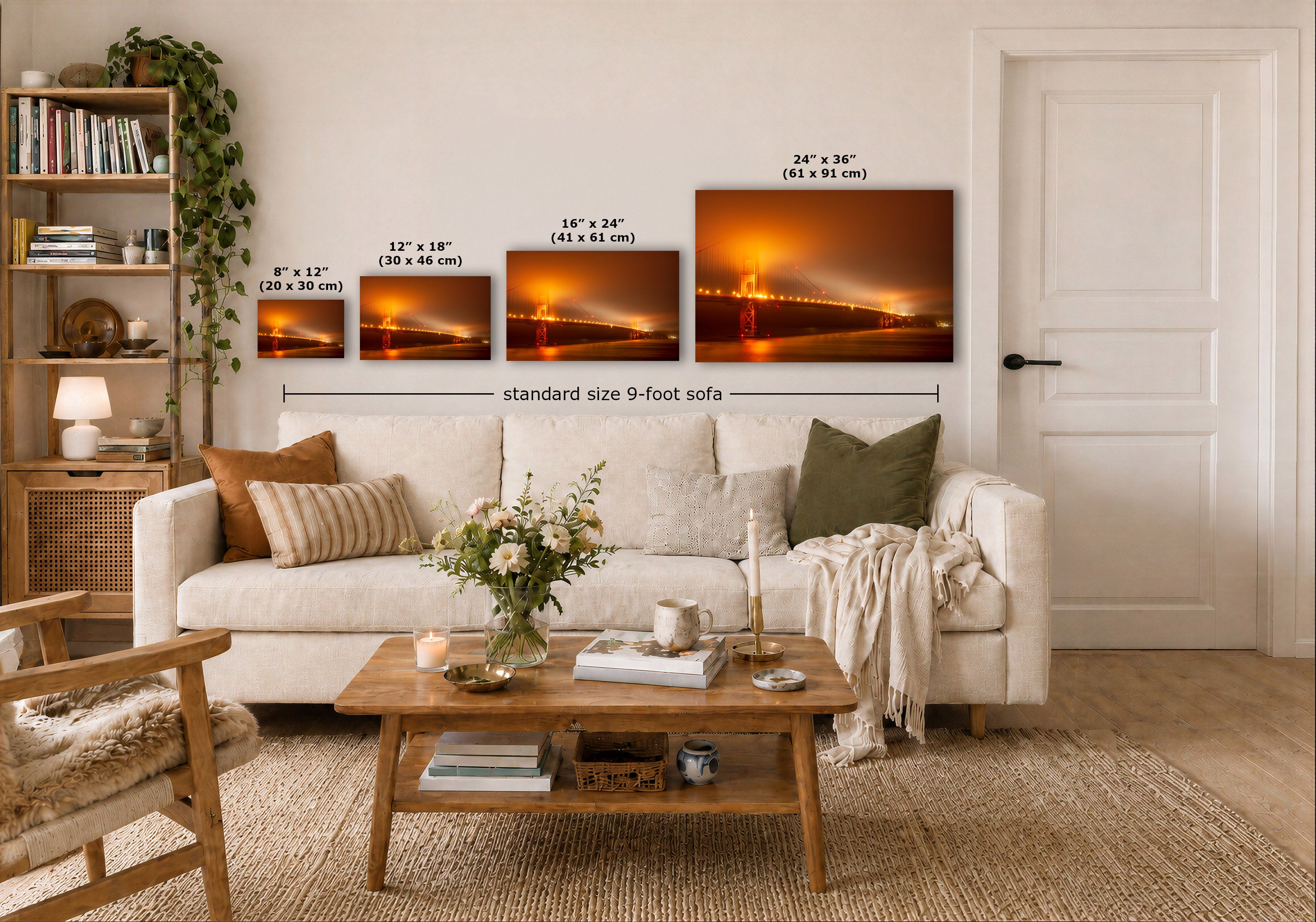 A staged living room showing a set of four framed wall art prints above a cream sofa, with size labels overlaid for each print. The prints depict a glowing orange Golden Gate Bridge after sunset.