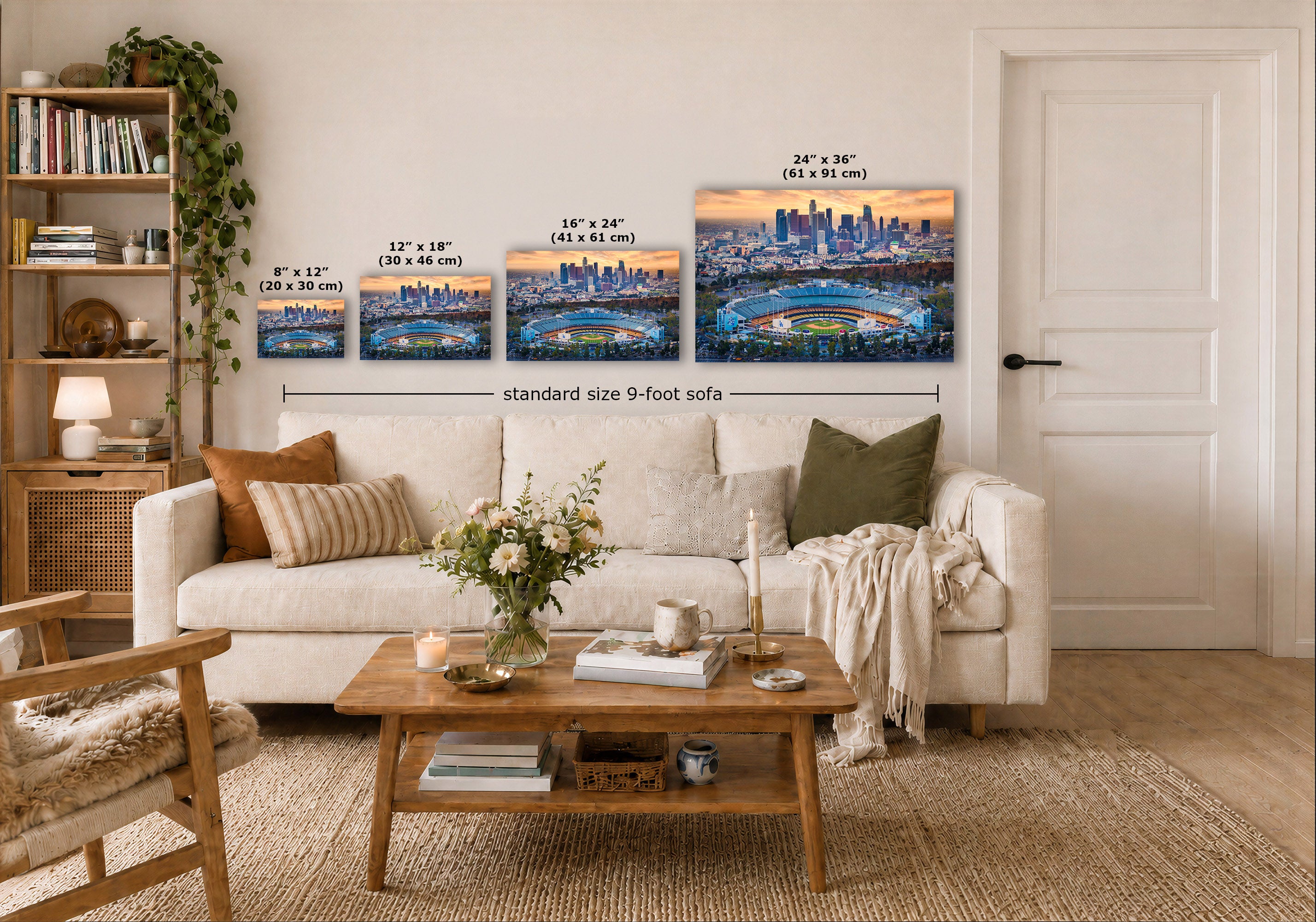 A staged living room shows a white sofa, wooden coffee table, shelving, and a wall with four Dodger Stadium wall art prints. White text labels indicate the sizes of the prints and notes 'standard size 9-foot sofa'.