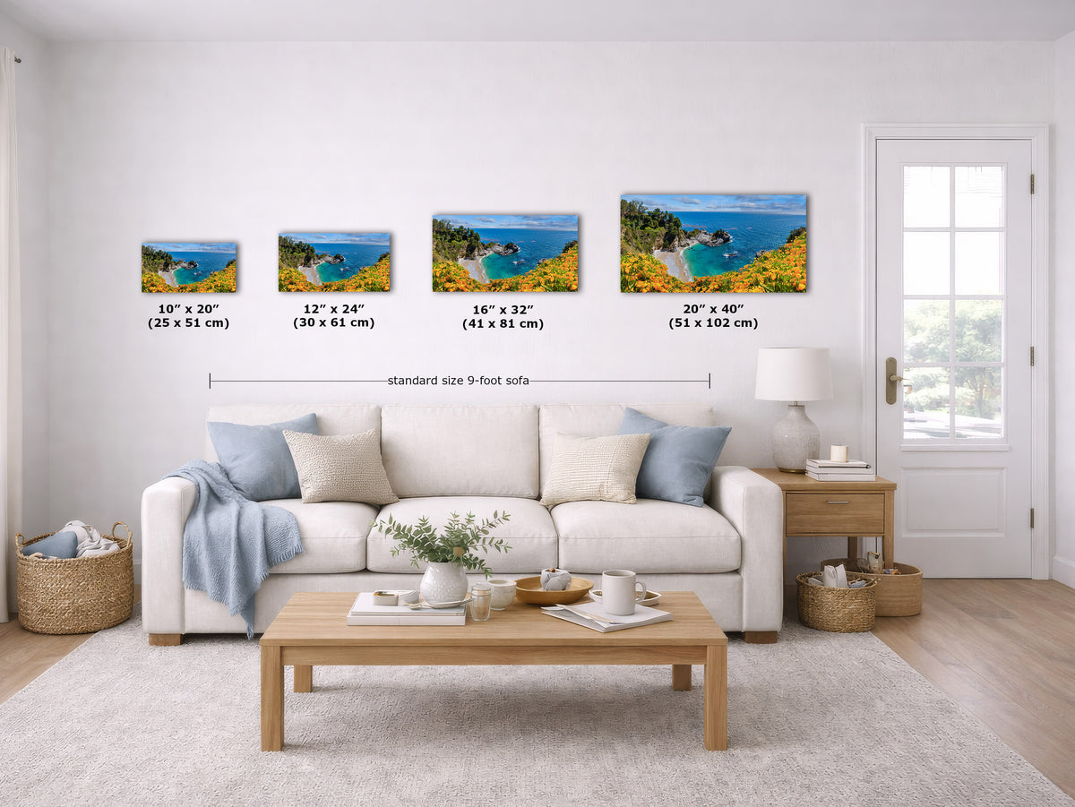 A staged living room showing four framed coastal landscape prints mounted on the wall above a sofa, with size labels beneath each print and a total width note across the set.