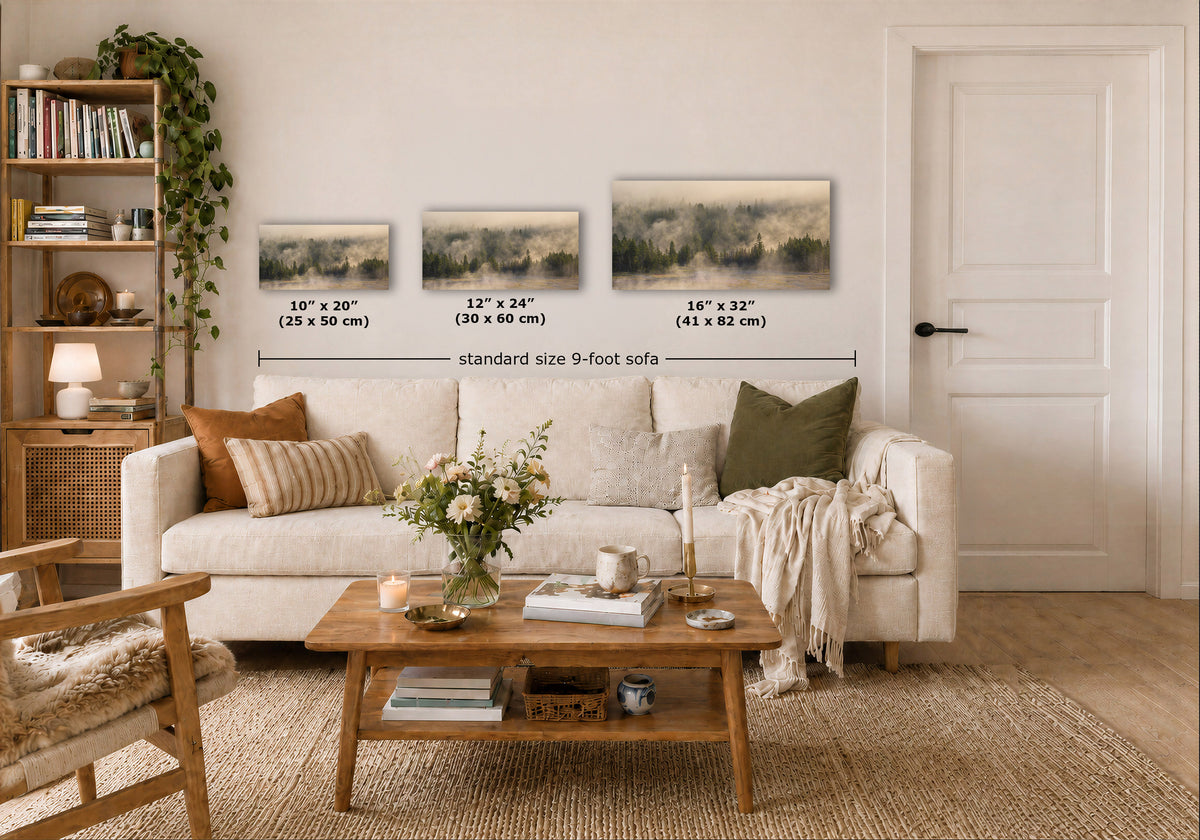 Three framed landscape art prints displayed above a white sofa in a styled living room, with overlaid dimensions showing 10" x 20", 12" x 24", and 16" x 32" sizes and a note for a standard size 9-foot sofa.