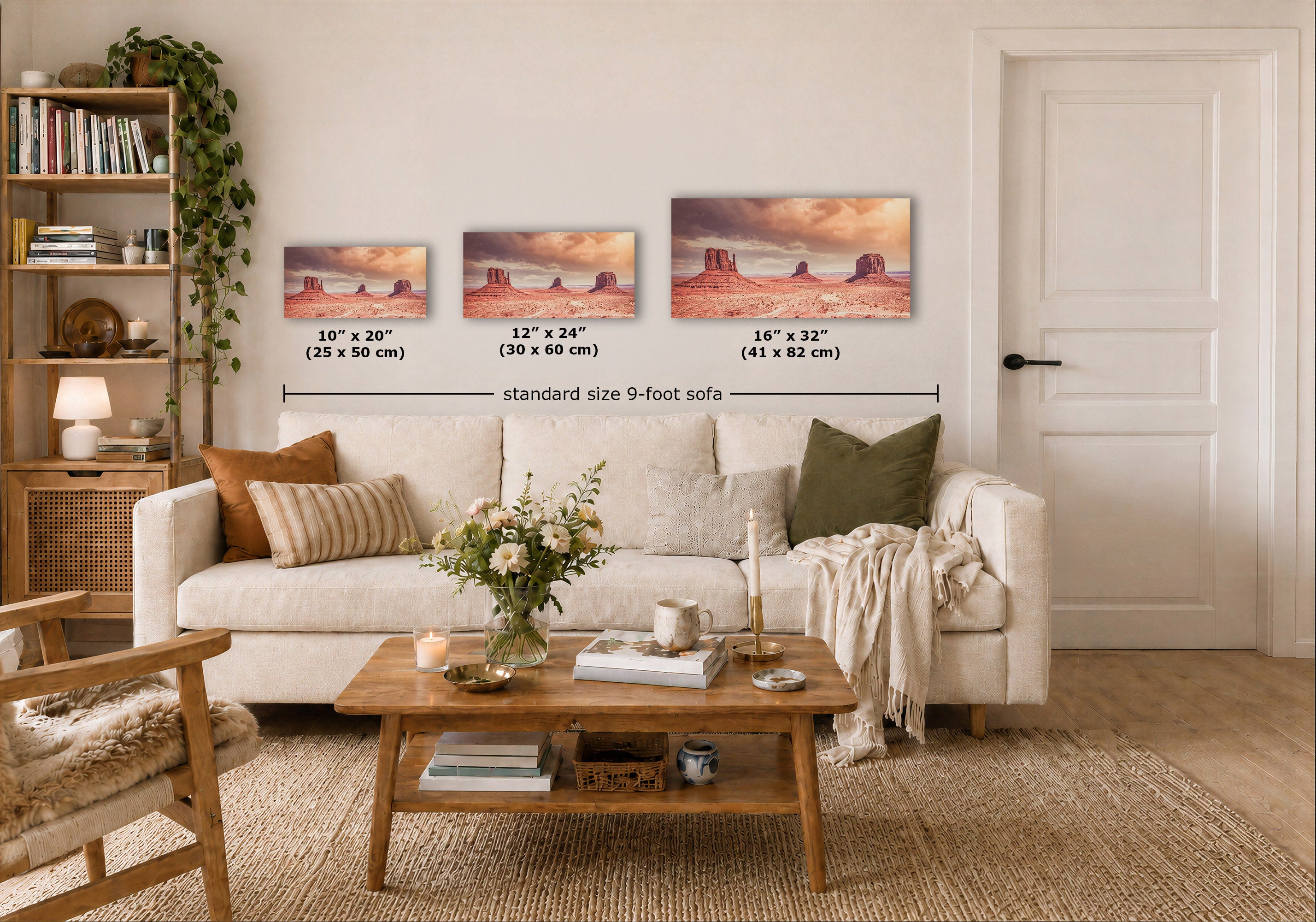 Three desert landscape wall art prints are displayed above a white sofa in a styled living room. The prints show red rock desert scenes with sunset tones, and overlaid text indicates sizes 10 x 20, 12 x 24, and 16 x 32 inches, with a dimension line reading standard size 9-foot sofa.