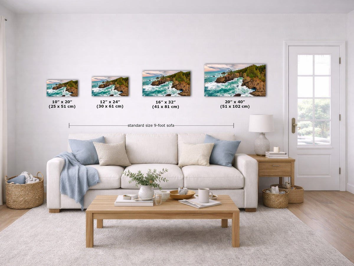 A staged living room shows four coastal landscape wall art prints above a white sofa, with size labels for each print. Because a real interior environment is present, this is Lifestyle rather than Product/Packaging, even though the prints are the product.