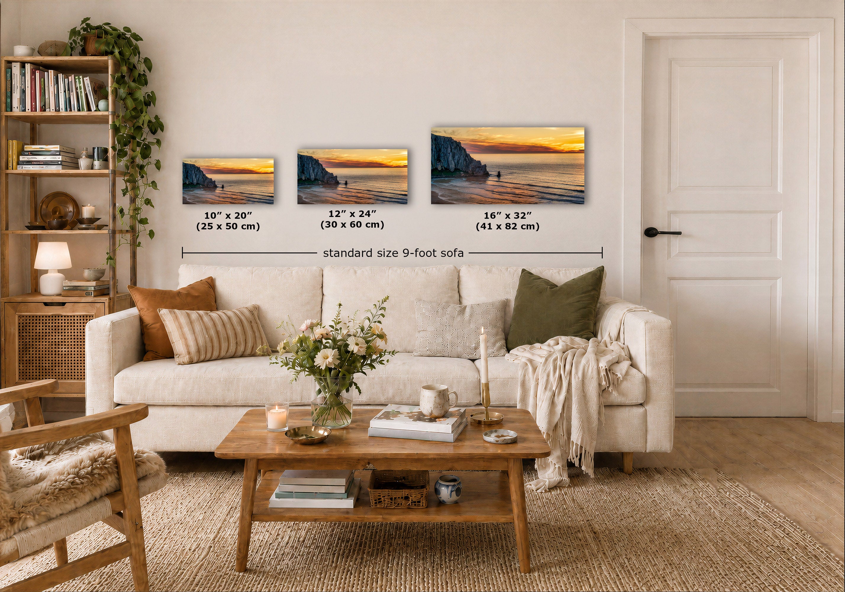 Three wall art prints showing coastal sunset scenes are displayed above a white sofa in a styled living room. Black dimension lines and text indicate the sizes of the three prints: 10 x 20 inches, 12 x 24 inches, and 16 x 32 inches, with a note reading 'standard size 9-foot sofa'.