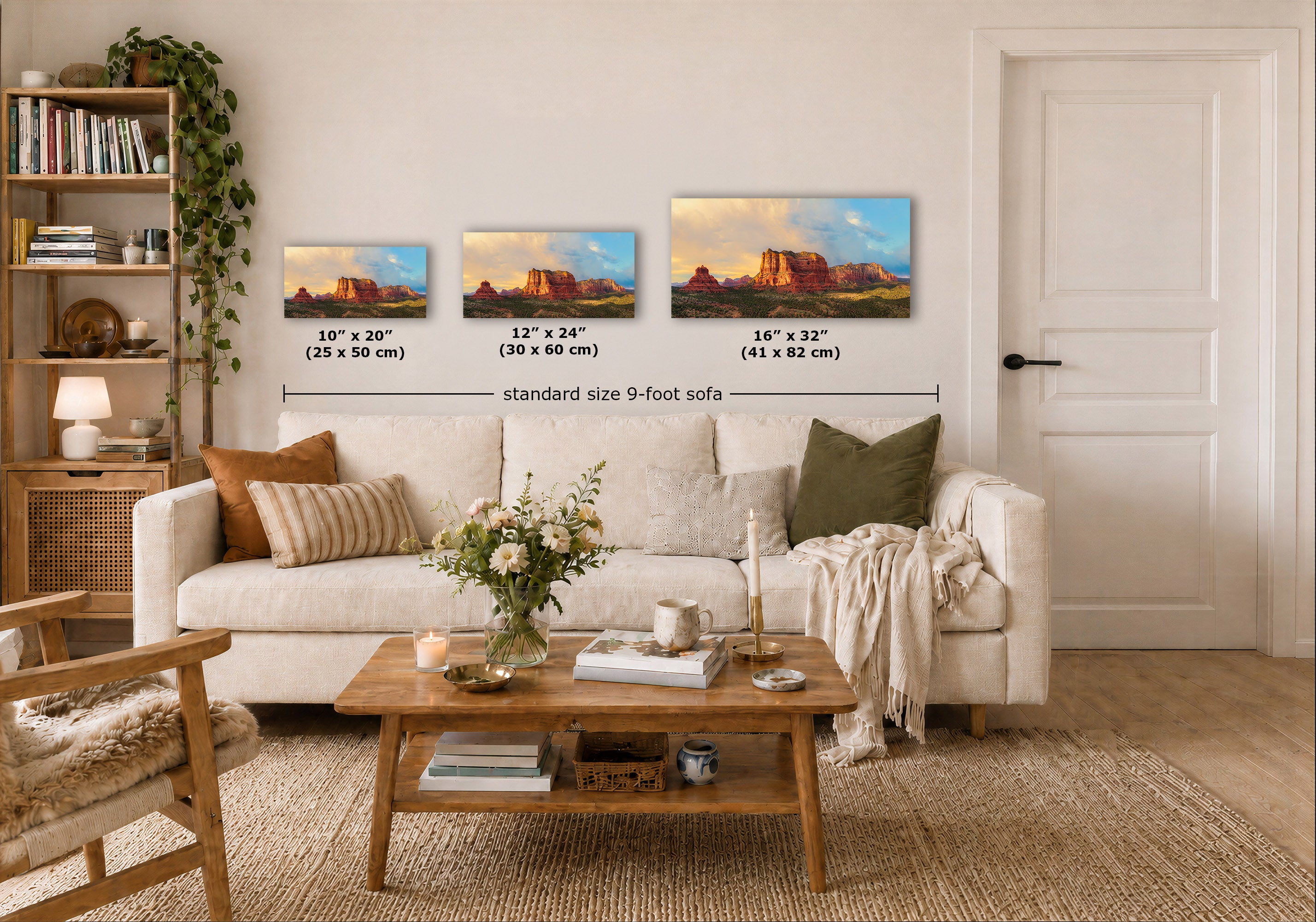 Three landscape art prints of red rock canyons are displayed on a beige wall above a white sofa in a styled living room. The prints show sunset scenes with warm orange and yellow tones, and the image includes size labels and a dimension line for the standard size 9-foot sofa.