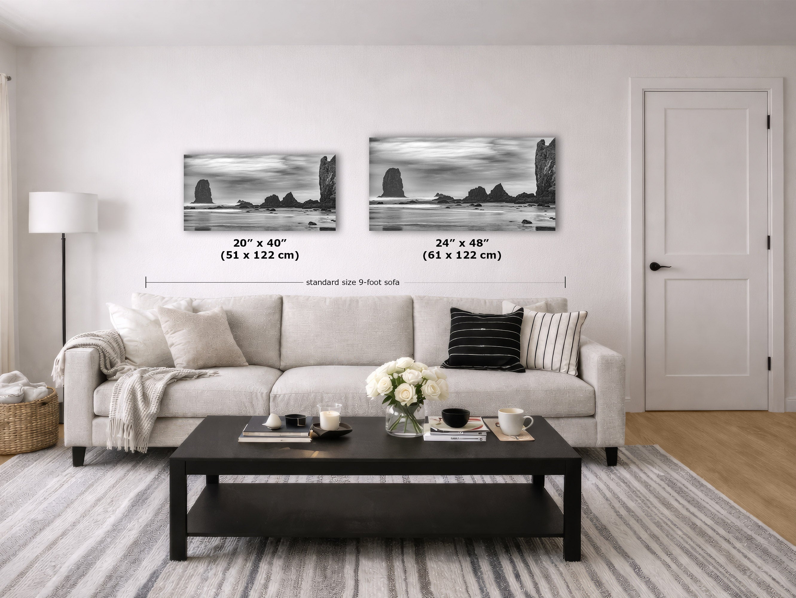 A staged living room showing two black-and-white coastal landscape wall art prints above a light sofa. The image includes size labels and dimension lines indicating the prints are 20 x 40 inches and 24 x 48 inches, with a 9-foot sofa width reference.