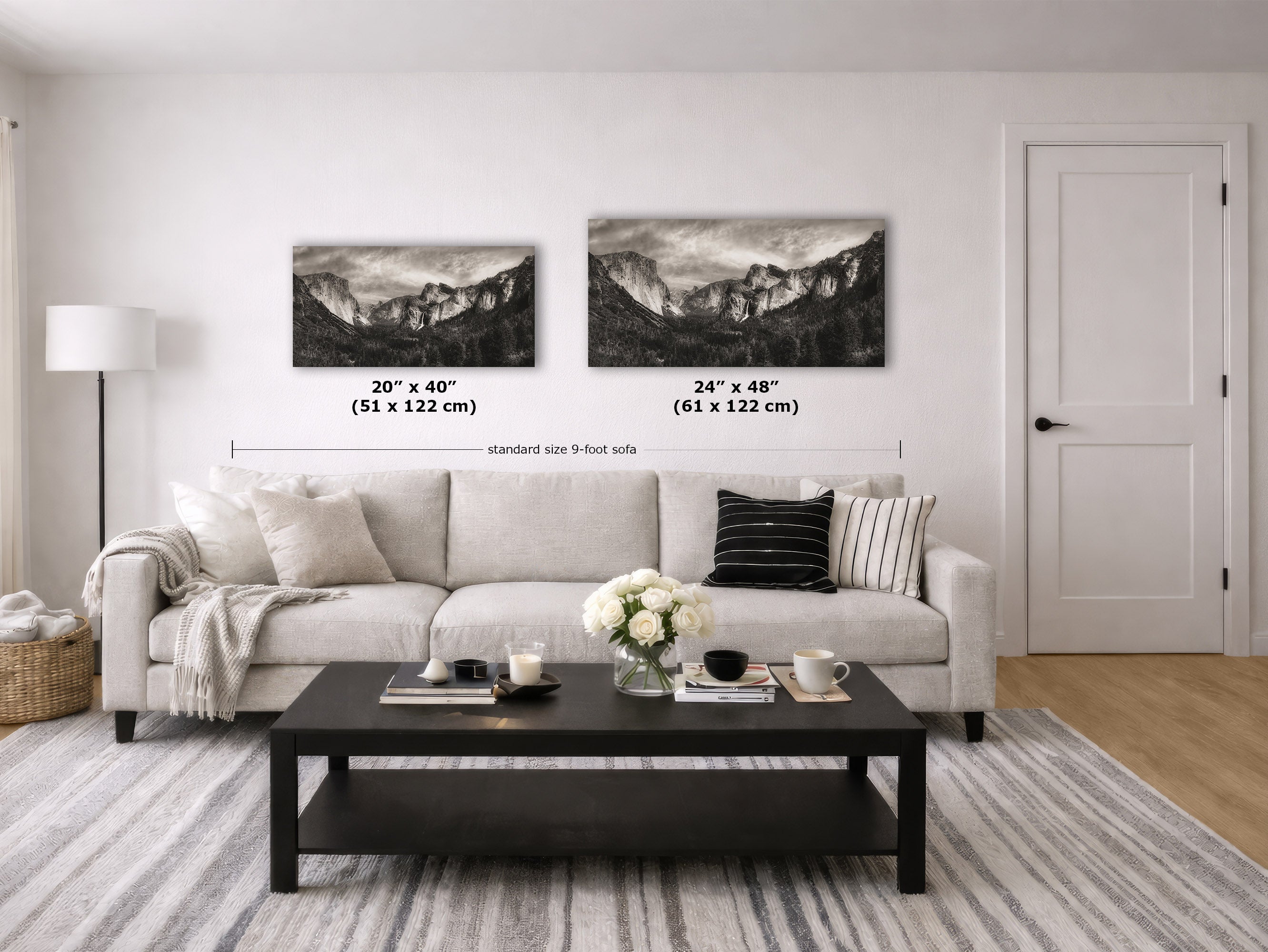 A styled living room showing two black and white mountain landscape wall art prints above a light beige sofa. The image includes size labels for the prints: 20" x 40" (51 x 122 cm) and 24" x 48" (61 x 122 cm).