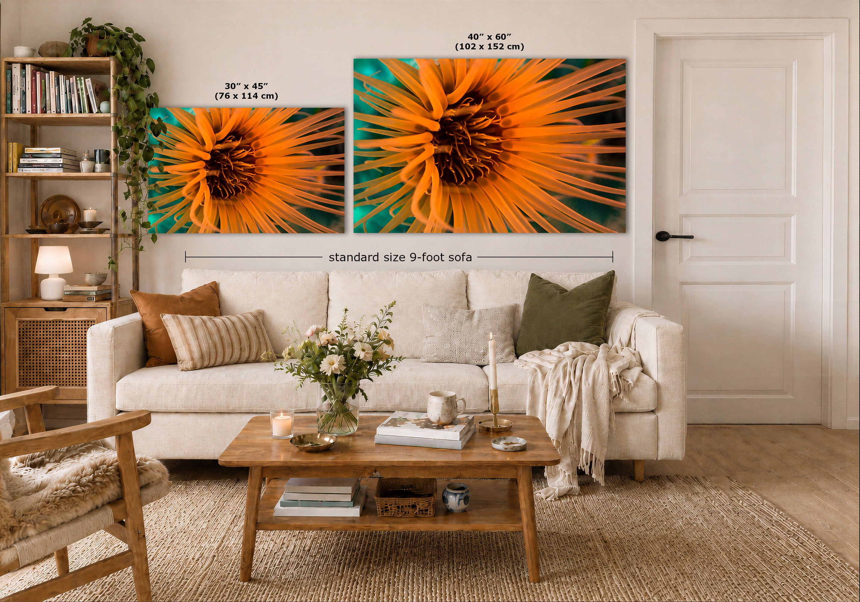 Two vibrant underwater anemone wall art prints displayed above a white sofa in a modern, well-lit living room. The left print is labeled as 30 x 45 inches, and the larger right print is labeled as 40 x 60 inches, with a dimension marker indicating a standard 9-foot sofa width.