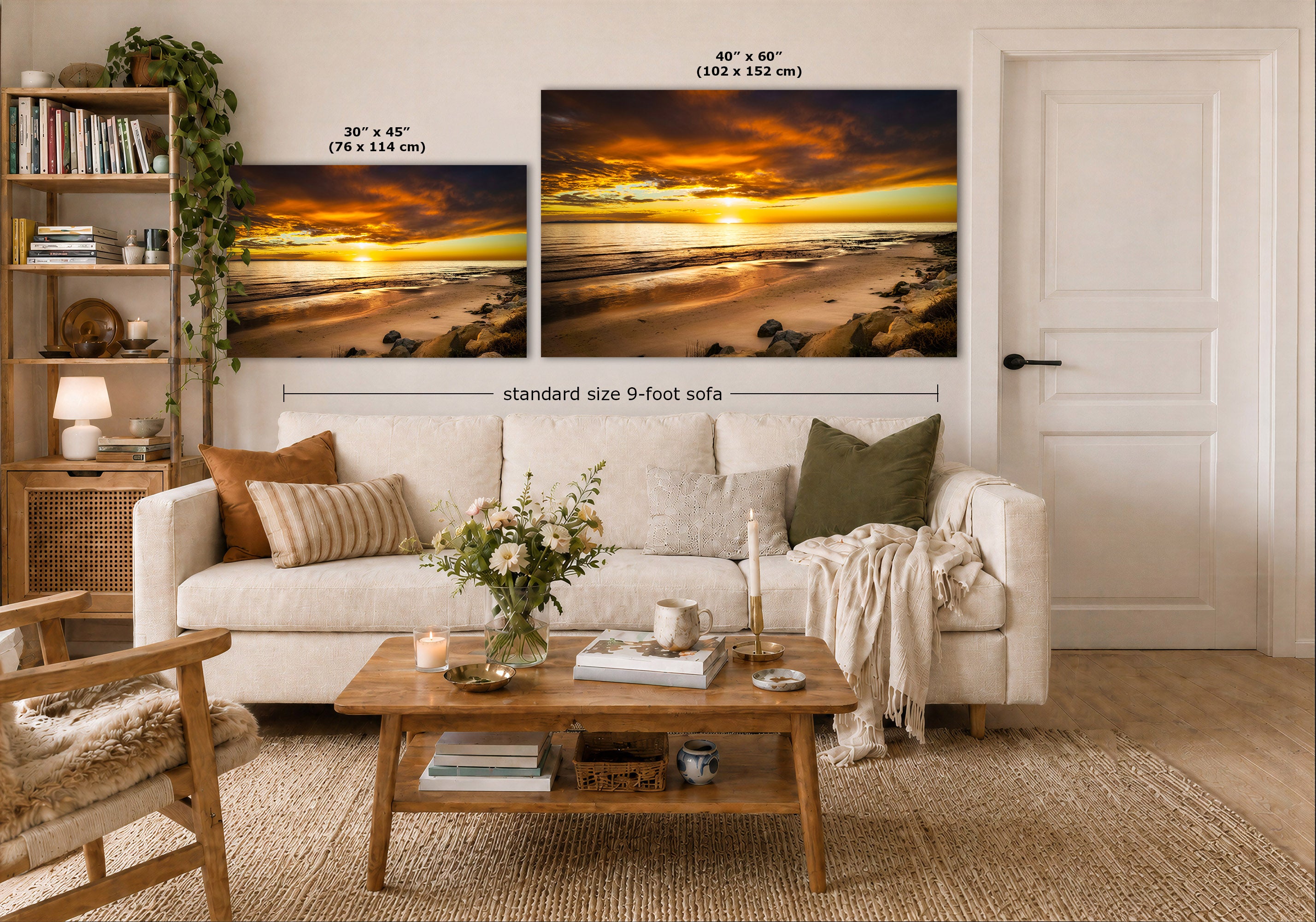 A styled living room showing two wall art prints above a white sofa. The prints depict dramatic golden beach sunsets, with one smaller 30 x 45 in print and one larger 40 x 60 in print.