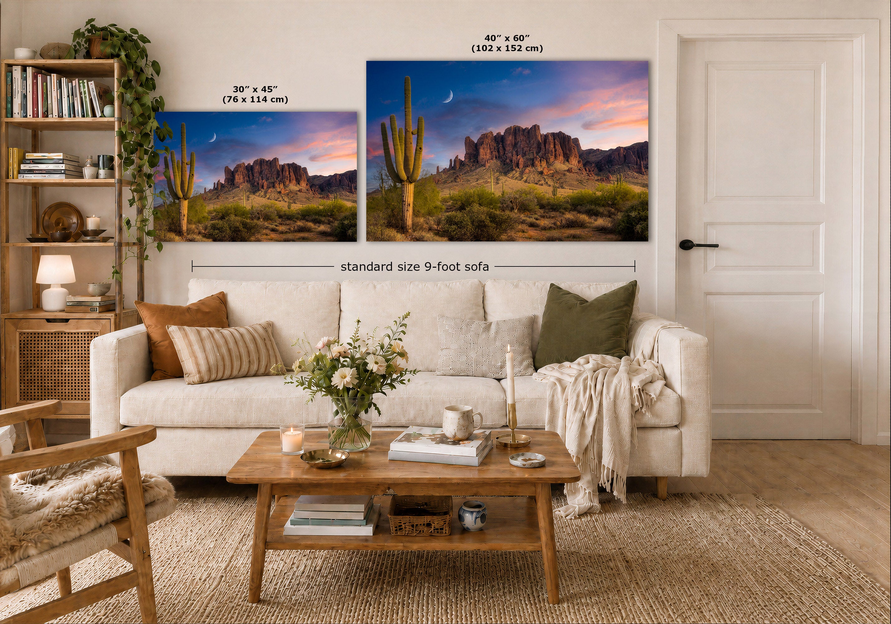 A staged living room shows two desert mountain landscape prints above a white sofa. The left print is labeled 30 x 45 inches, and the larger right print is labeled 40 x 60 inches, with a note reading standard size 9-foot sofa.