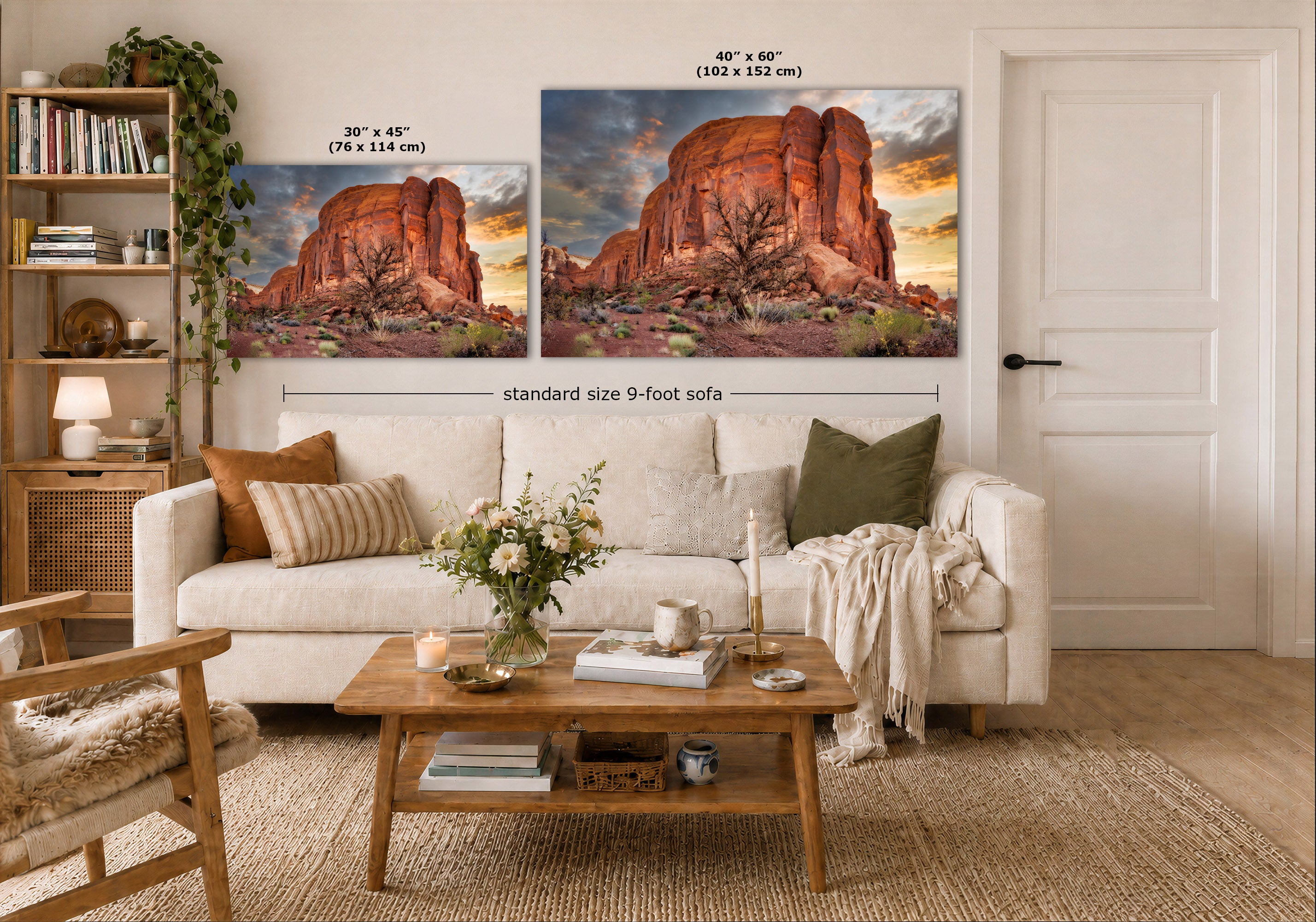 Two wall art prints showing red rock desert landscapes hang above a white sofa in a styled living room. The left print is labeled 30 x 45 in (76 x 114 cm), and the larger right print is labeled 40 x 60 in (102 x 152 cm), with a note reading standard size 9-foot sofa.