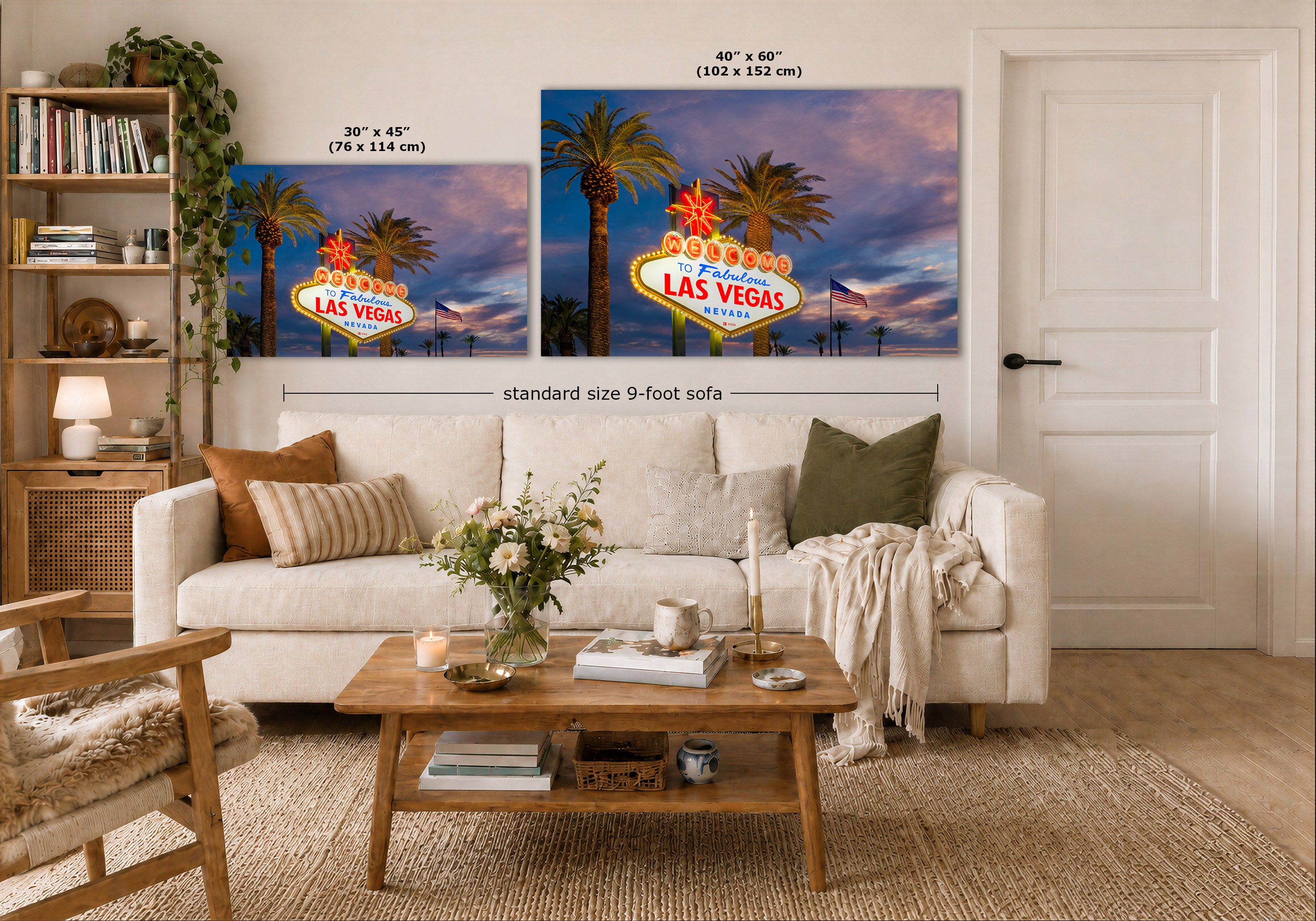 A staged living room shows two wall art prints above a sofa, each featuring a colorful Las Vegas sign and palm trees at sunset. 