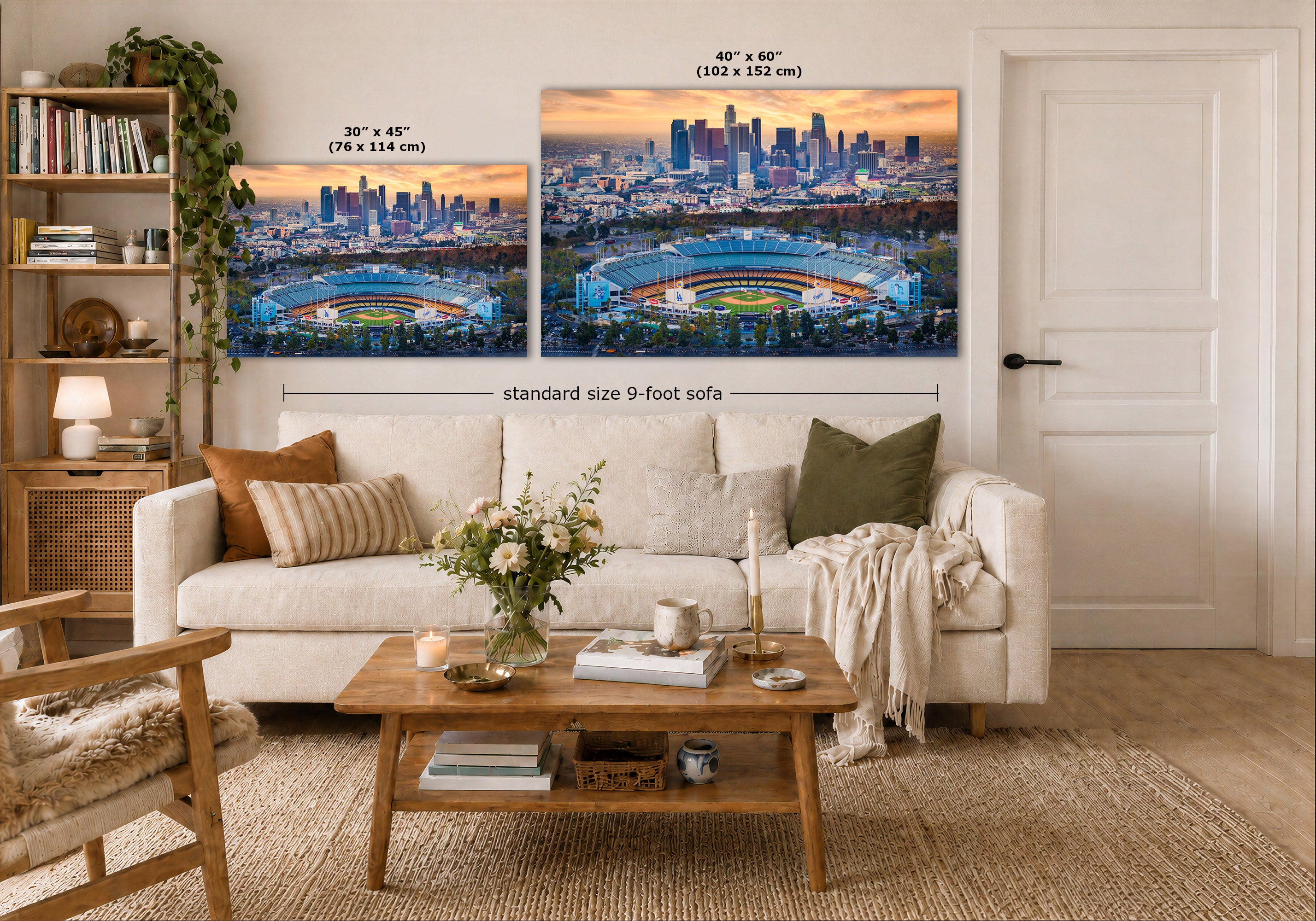 A styled living room showing two framed city-and-stadium wall art prints above a white sofa, with size callouts reading 30 x 45 inches and 40 x 60 inches plus a note for a standard size 9-foot sofa.