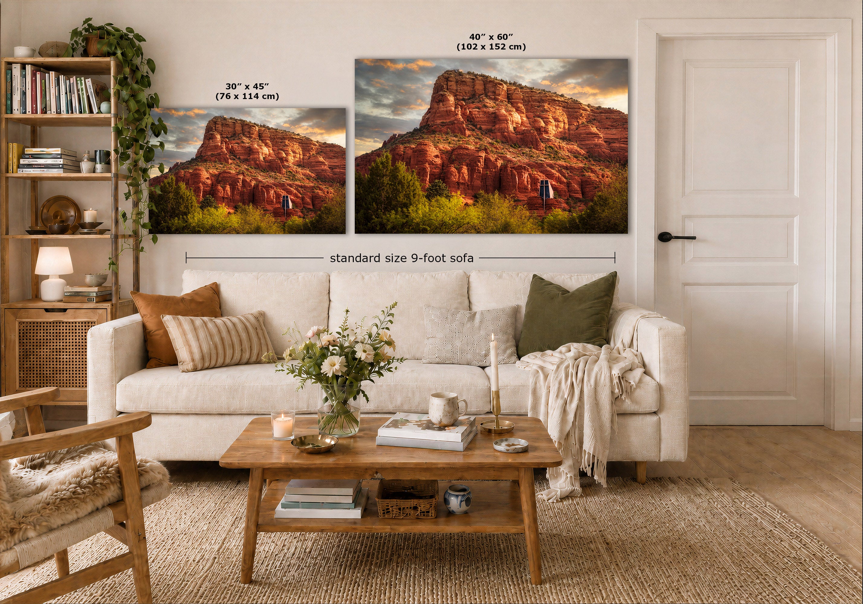 A styled living room showing two large wall art prints above a white sofa. The prints depict a desert rock landscape at sunset, with one smaller version labeled 30 x 45 in and one larger version labeled 40 x 60 in.